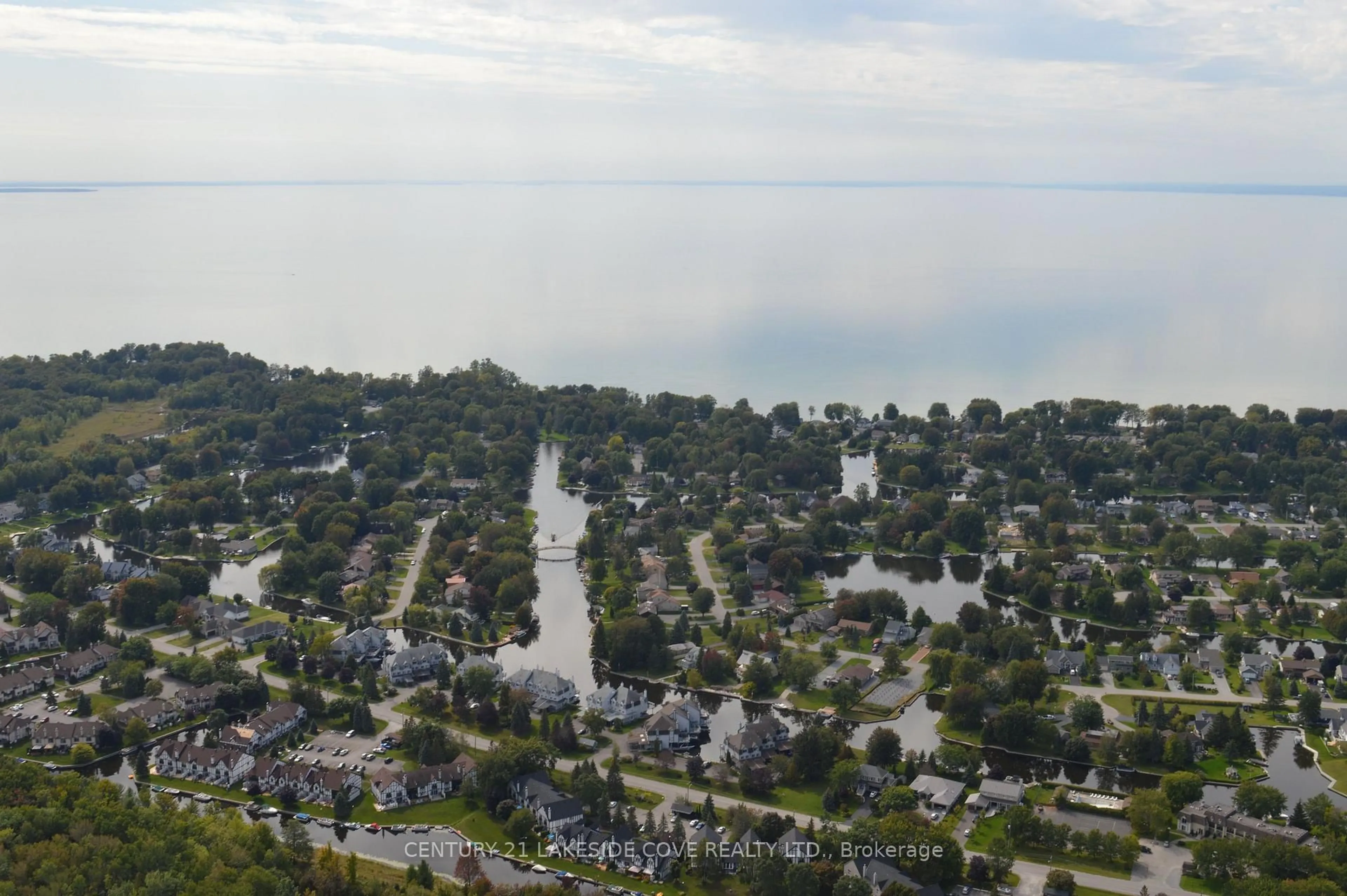 A pic from outside/outdoor area/front of a property/back of a property/a pic from drone, water/lake/river/ocean view for 71 Laguna Pkwy, Ramara Ontario L0K 1B0