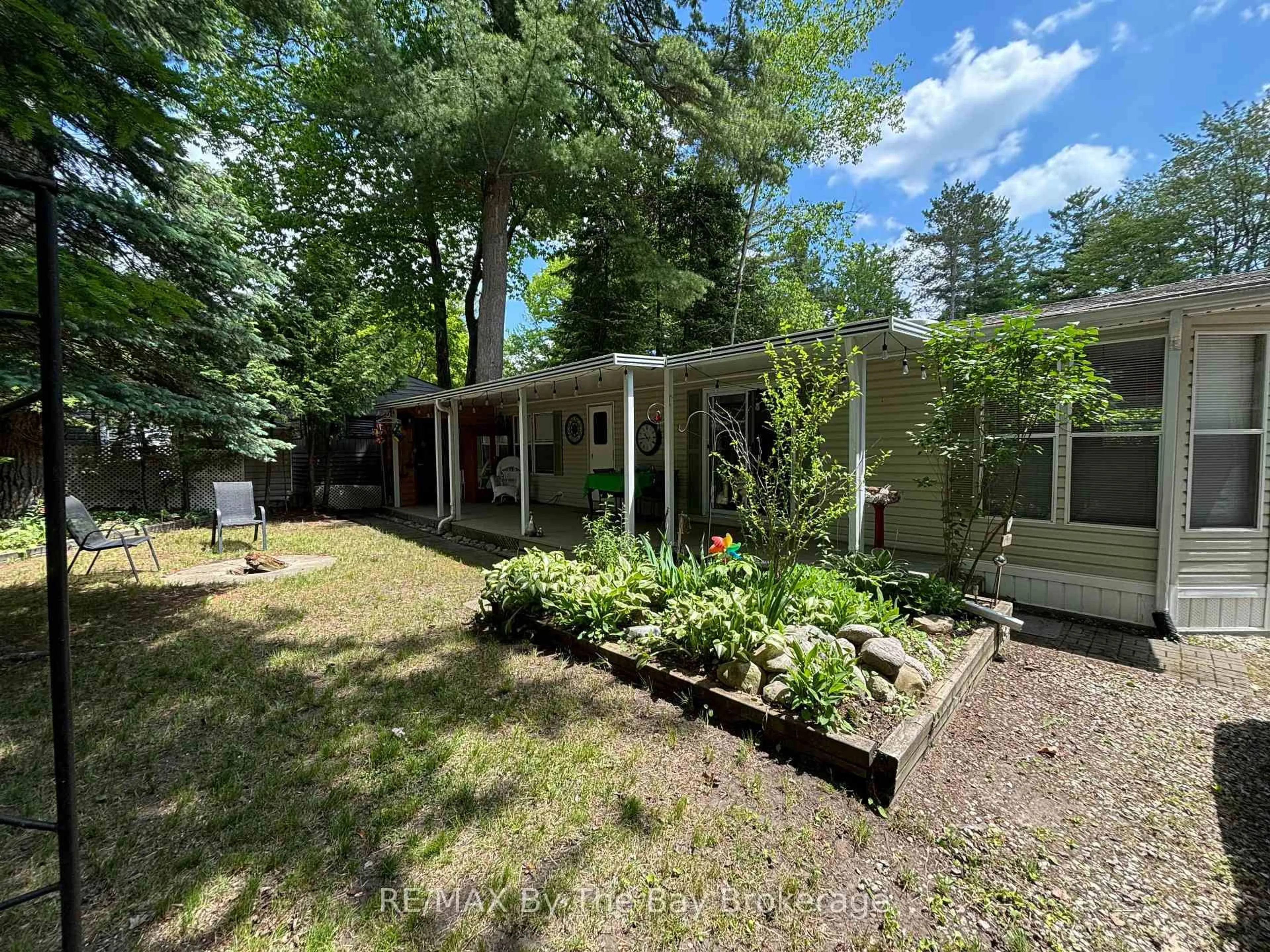 A pic from outside/outdoor area/front of a property/back of a property/a pic from drone, street for 85 Theme Park Dr #154, Wasaga Beach Ontario L9Z 1X7