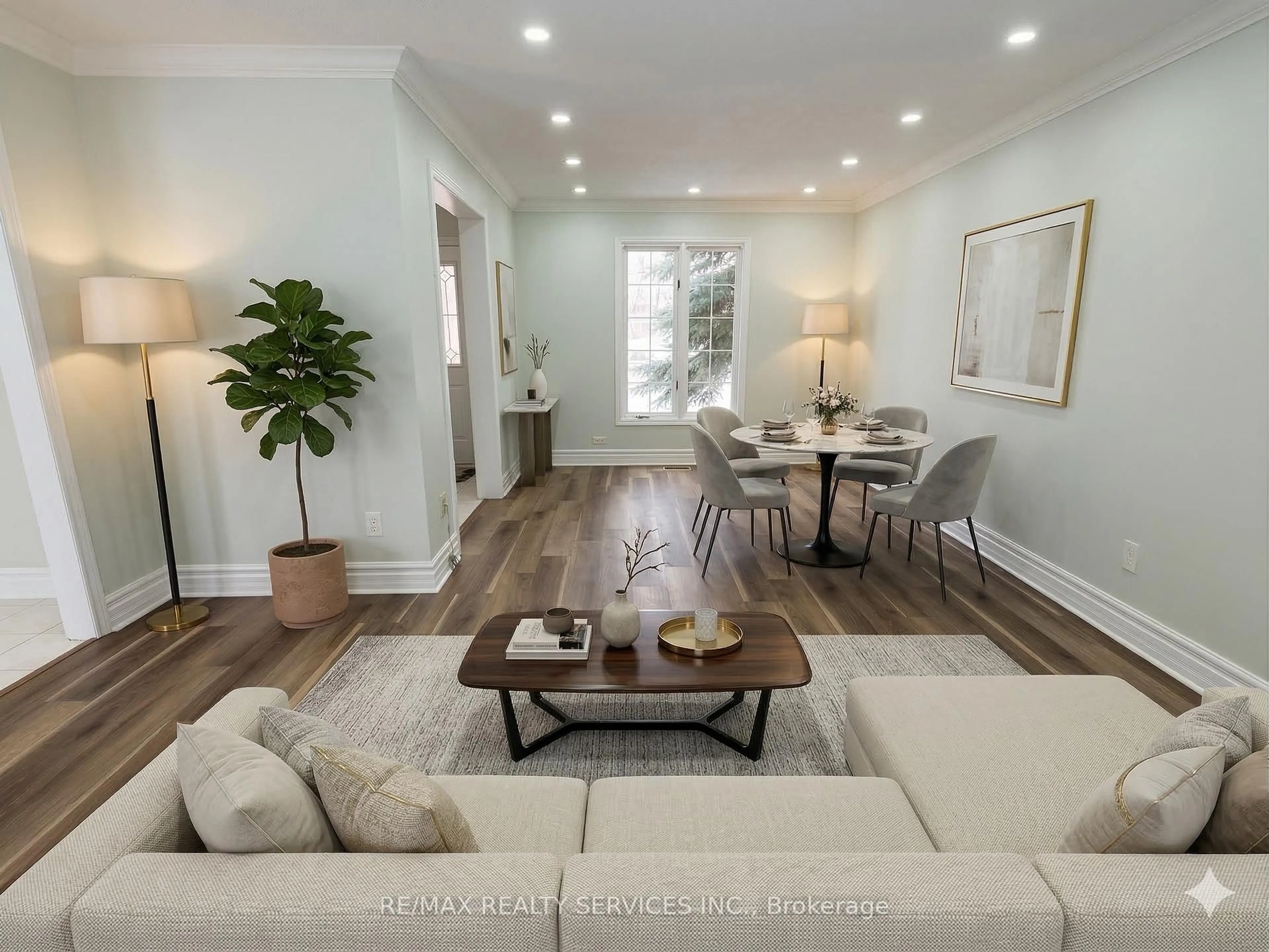 Living room with furniture, wood/laminate floor for 67 Livingstone St, Barrie Ontario L4N 7J2