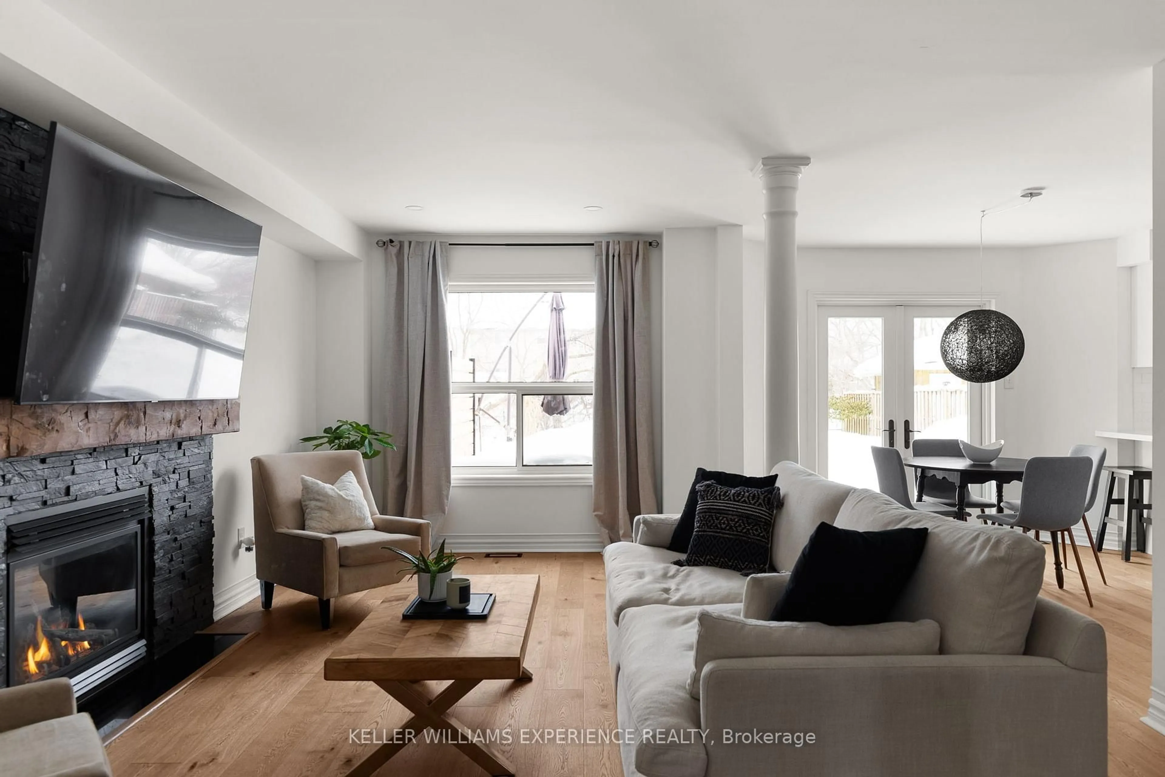 Living room with furniture, wood/laminate floor for 102 Country Lane, Barrie Ontario L4N 0N3