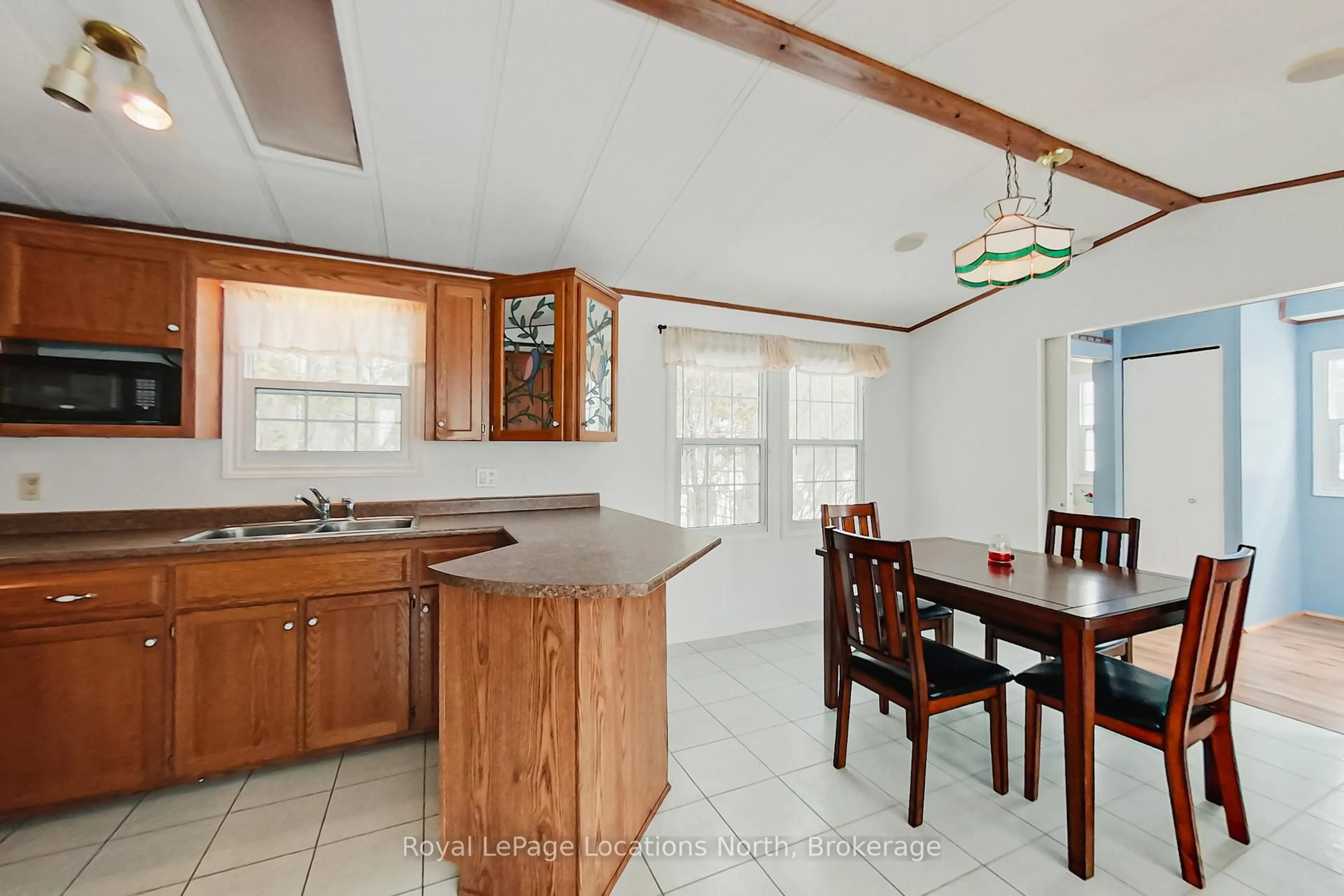 Open concept kitchen, ceramic/tile floor for 24 Prince Charles Ave, Springwater Ontario L0L 1P0