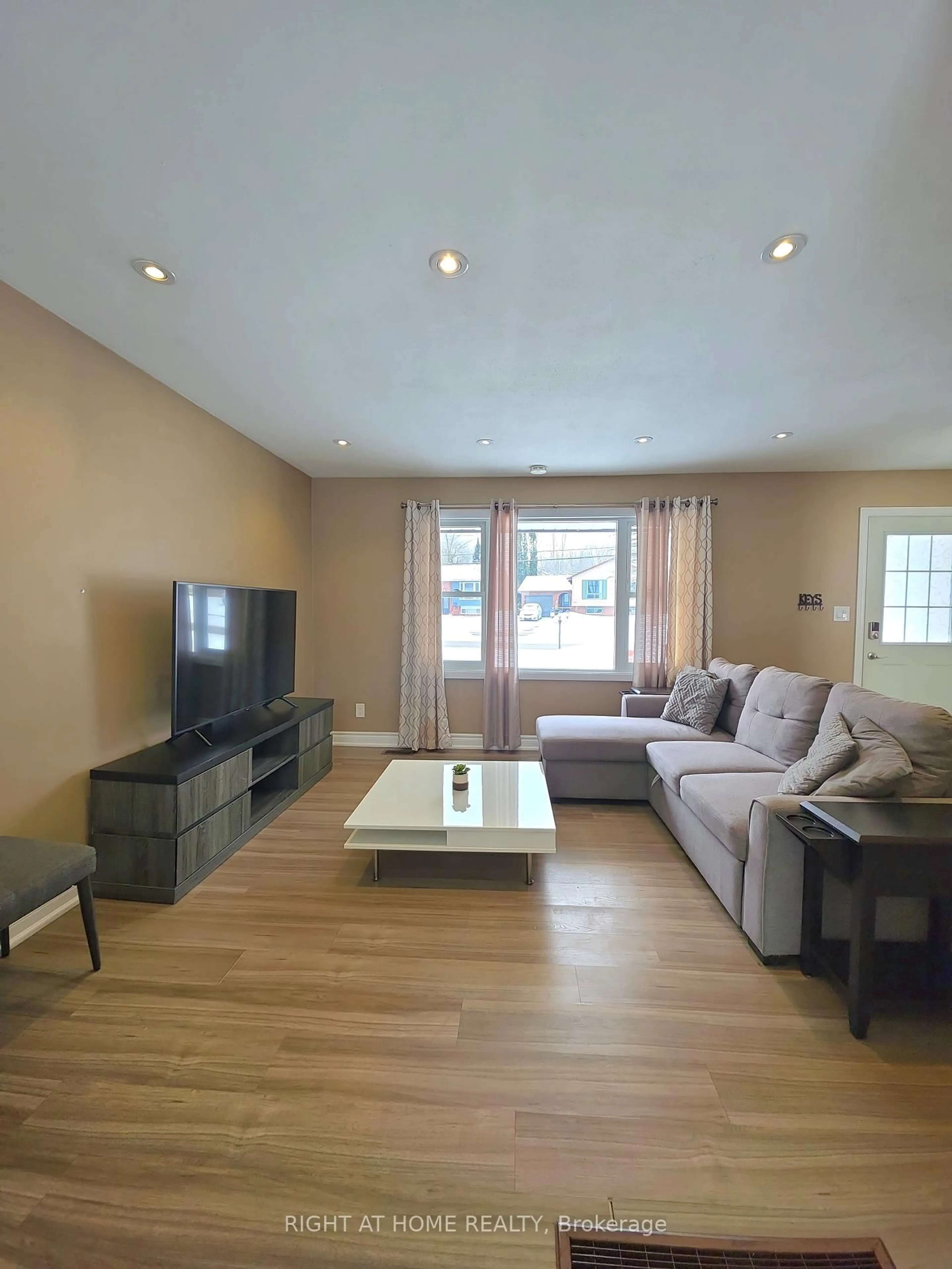 Living room with furniture, wood/laminate floor for 438 Forest Ave, Orillia Ontario L3V 4A1