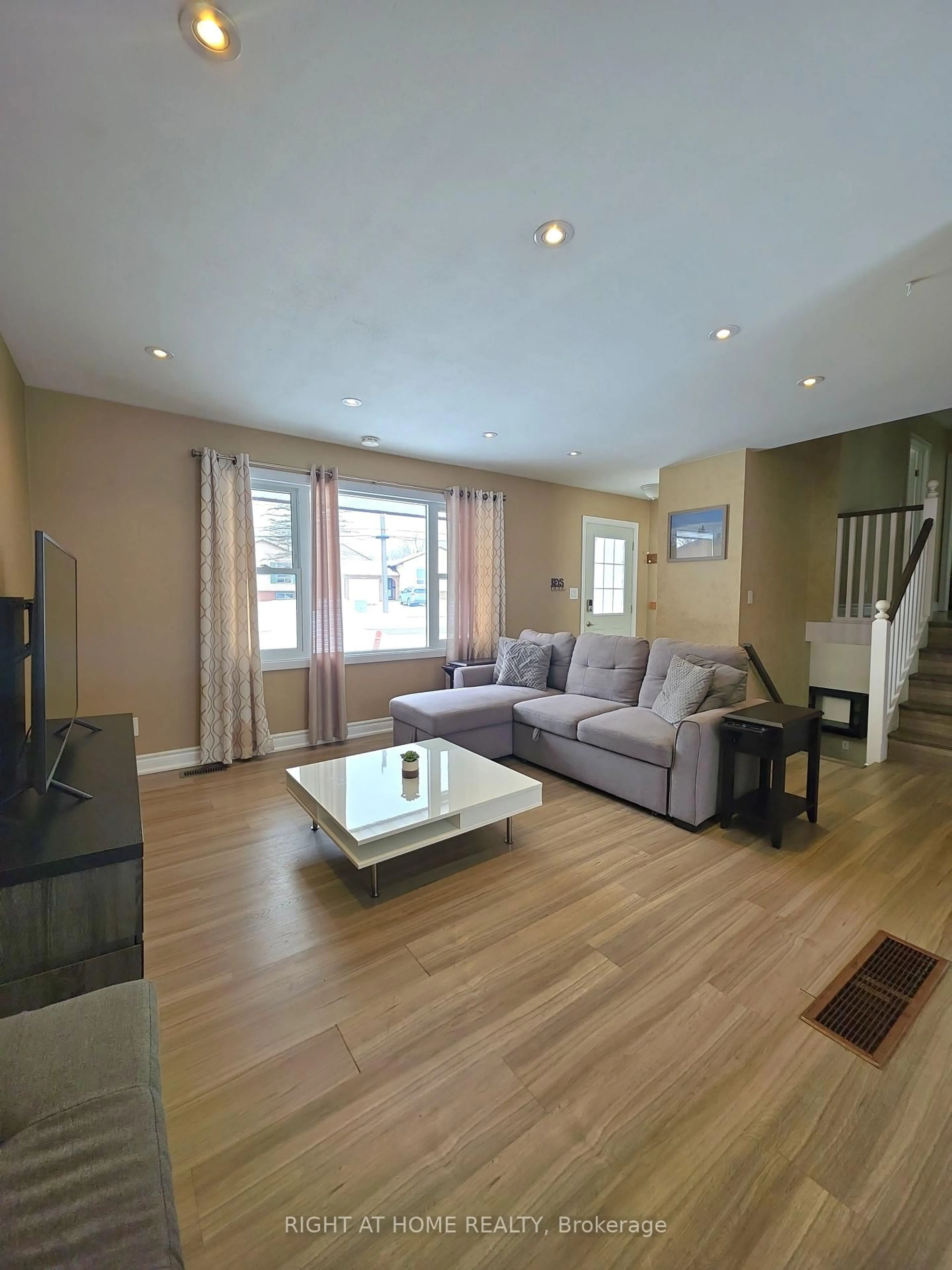 Living room with furniture, wood/laminate floor for 438 Forest Ave, Orillia Ontario L3V 4A1
