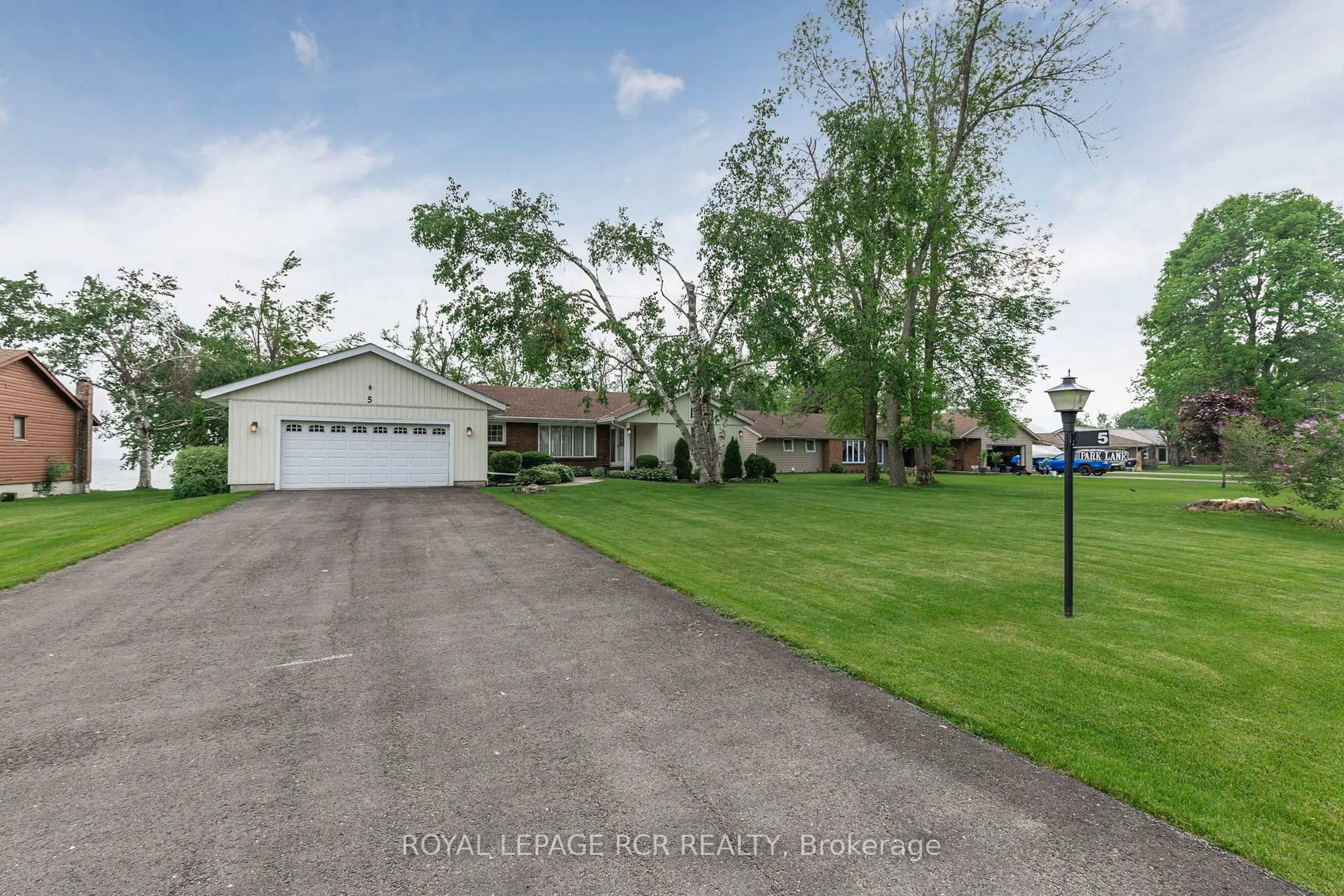 A pic from outside/outdoor area/front of a property/back of a property/a pic from drone, water/lake/river/ocean view for 5 Park Lane, Ramara Ontario L0K 1B0