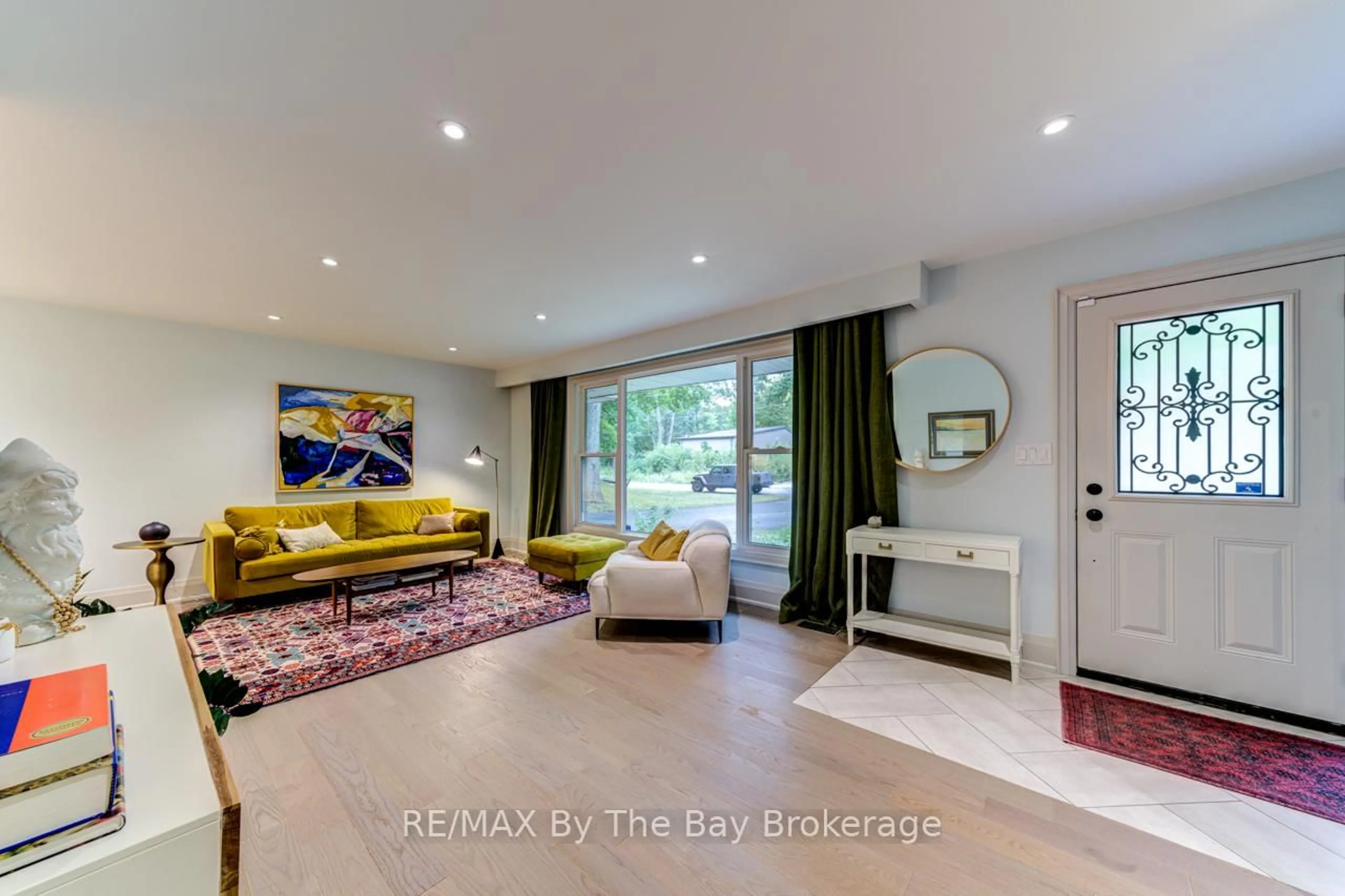 Living room with furniture, ceramic/tile floor for 63 Rodrium Rd, Wasaga Beach Ontario L9Z 1R5