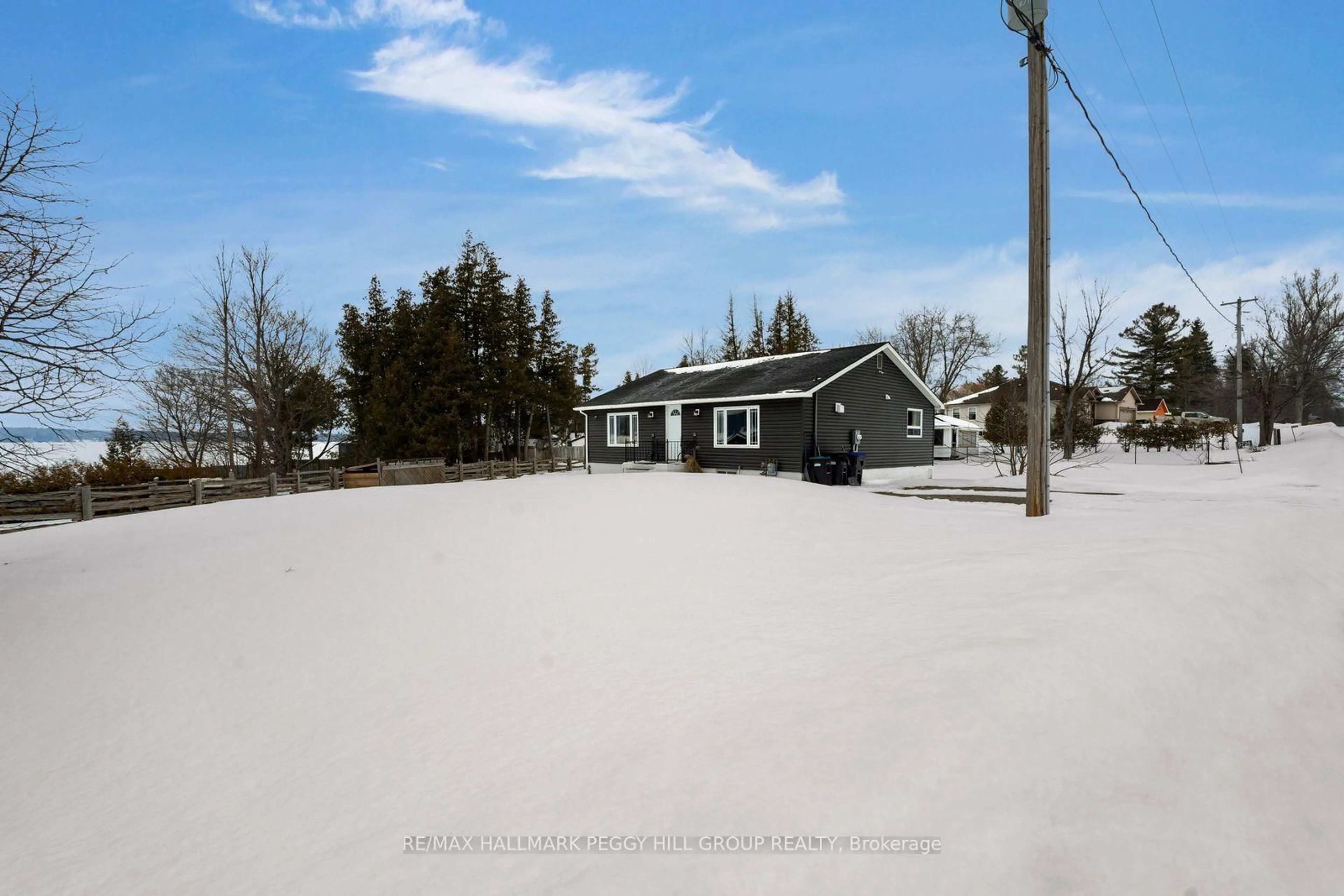 A pic from outside/outdoor area/front of a property/back of a property/a pic from drone, street for 5724 & 1 Penetanguishene Road & Cedar Lane, Springwater Ontario L0L 1P0