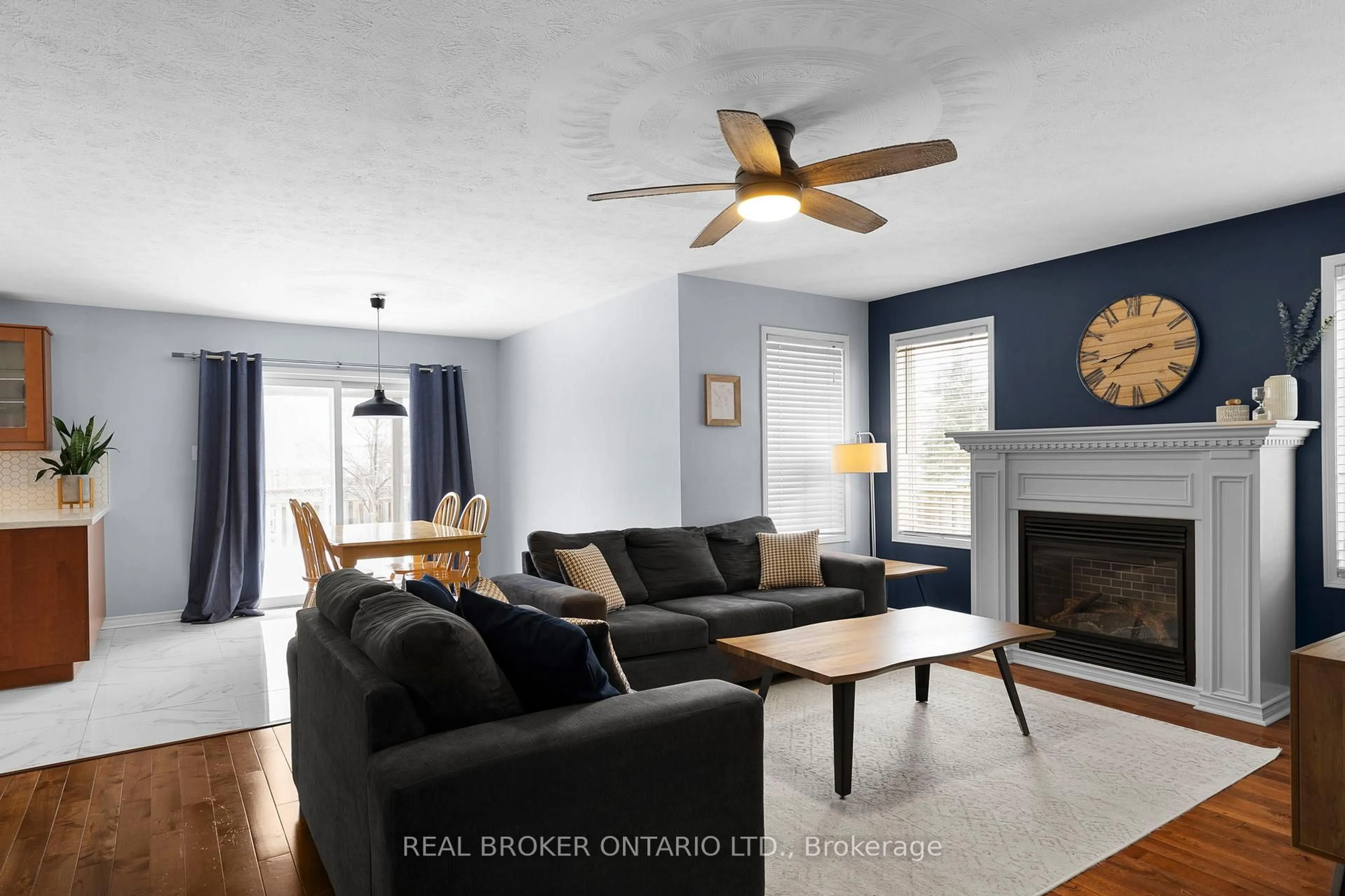 Living room with furniture, wood/laminate floor for 27 Vanessa Dr, Orillia Ontario L3V 7Y8