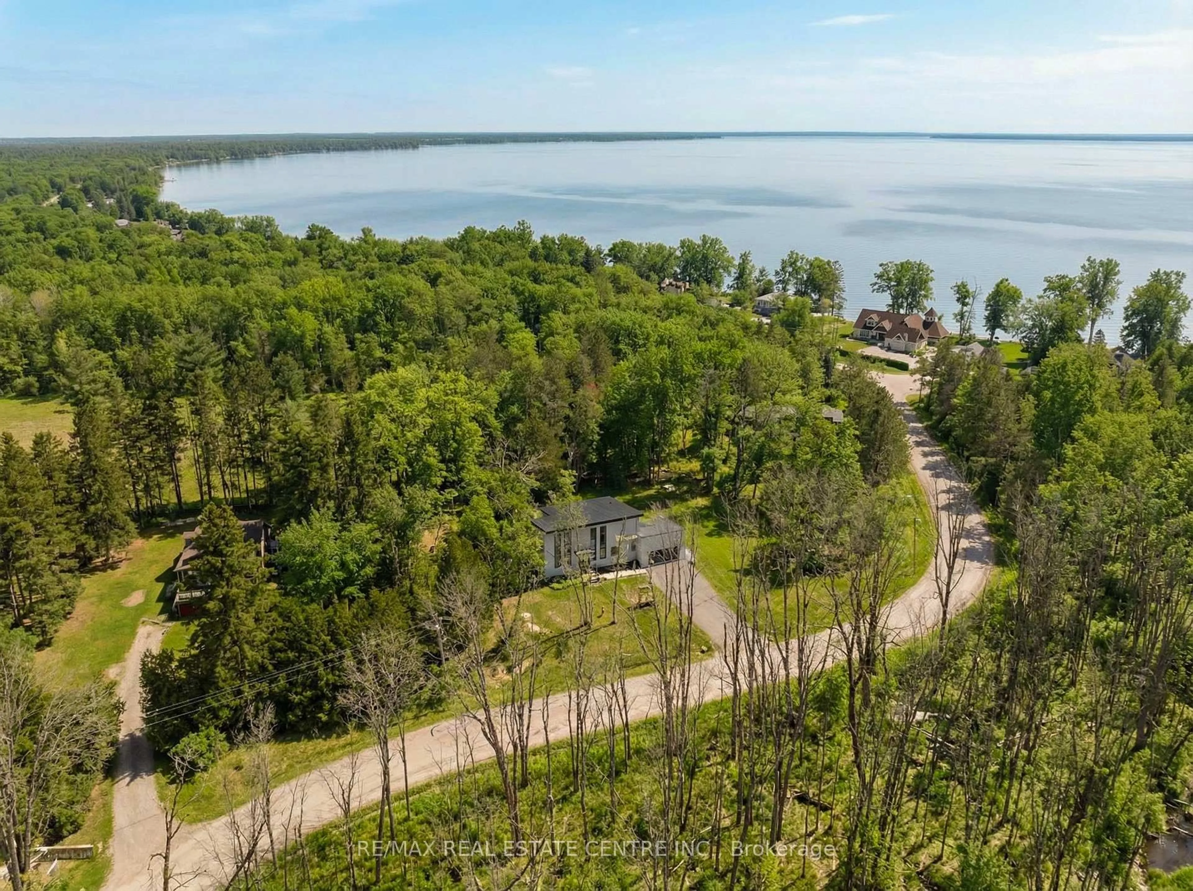 A pic from outside/outdoor area/front of a property/back of a property/a pic from drone, water/lake/river/ocean view for 3441 Louis Lane, Ramara Ontario L0K 1B0