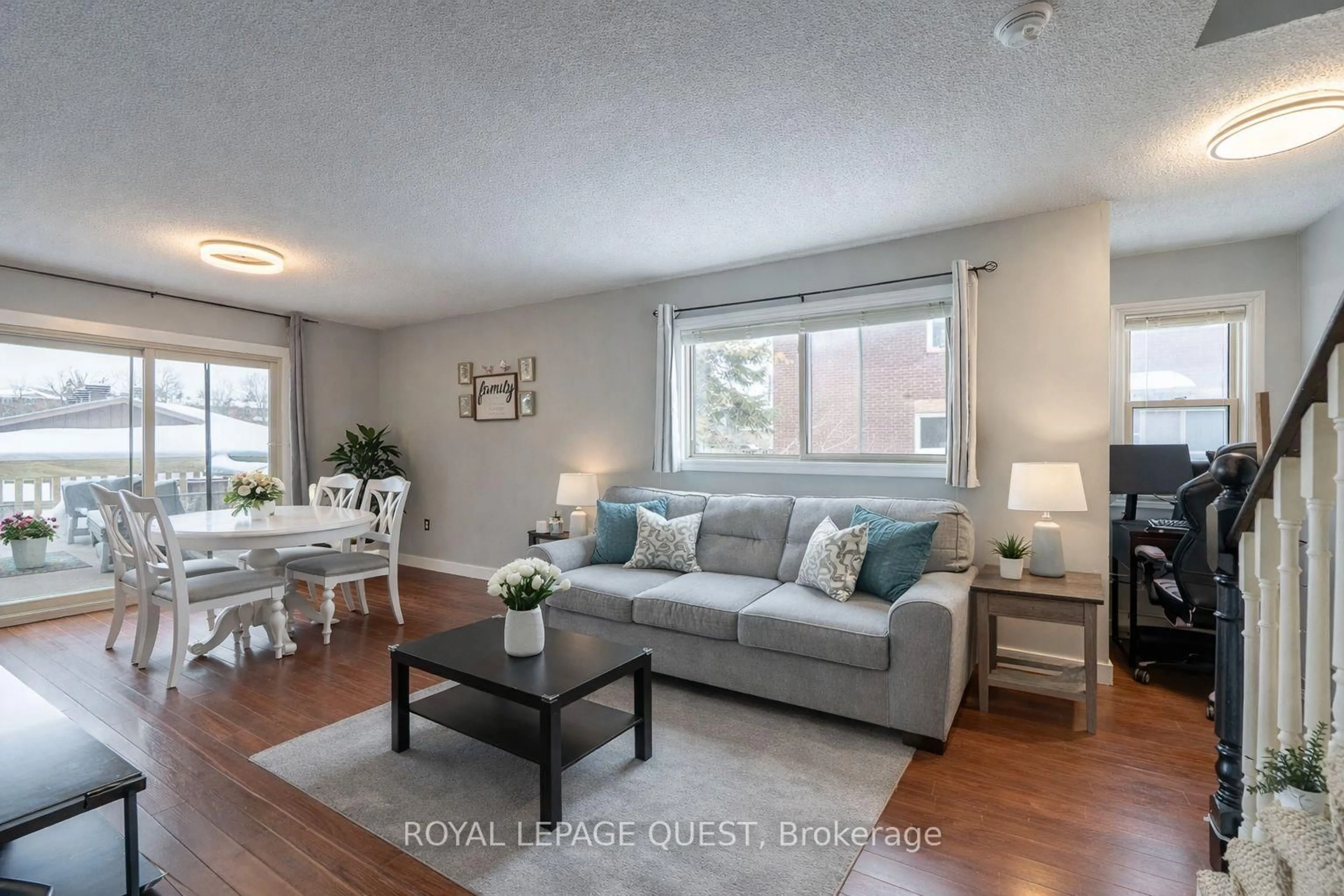Living room with furniture, wood/laminate floor for 23 Meadow Lane #7, Barrie Ontario L4N 7K3