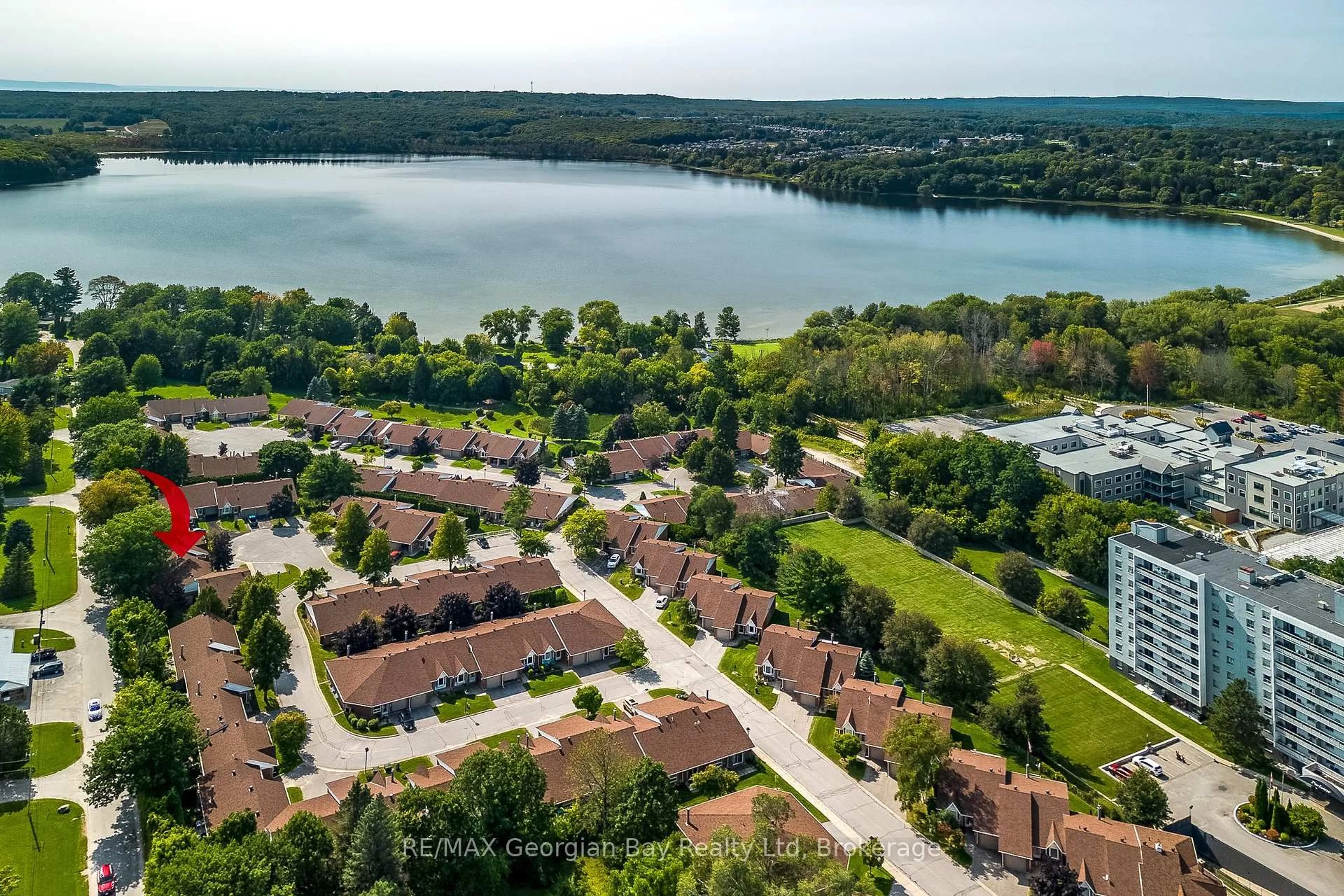A pic from outside/outdoor area/front of a property/back of a property/a pic from drone, water/lake/river/ocean view for 696 King St #70, Midland Ontario L4R 5B6