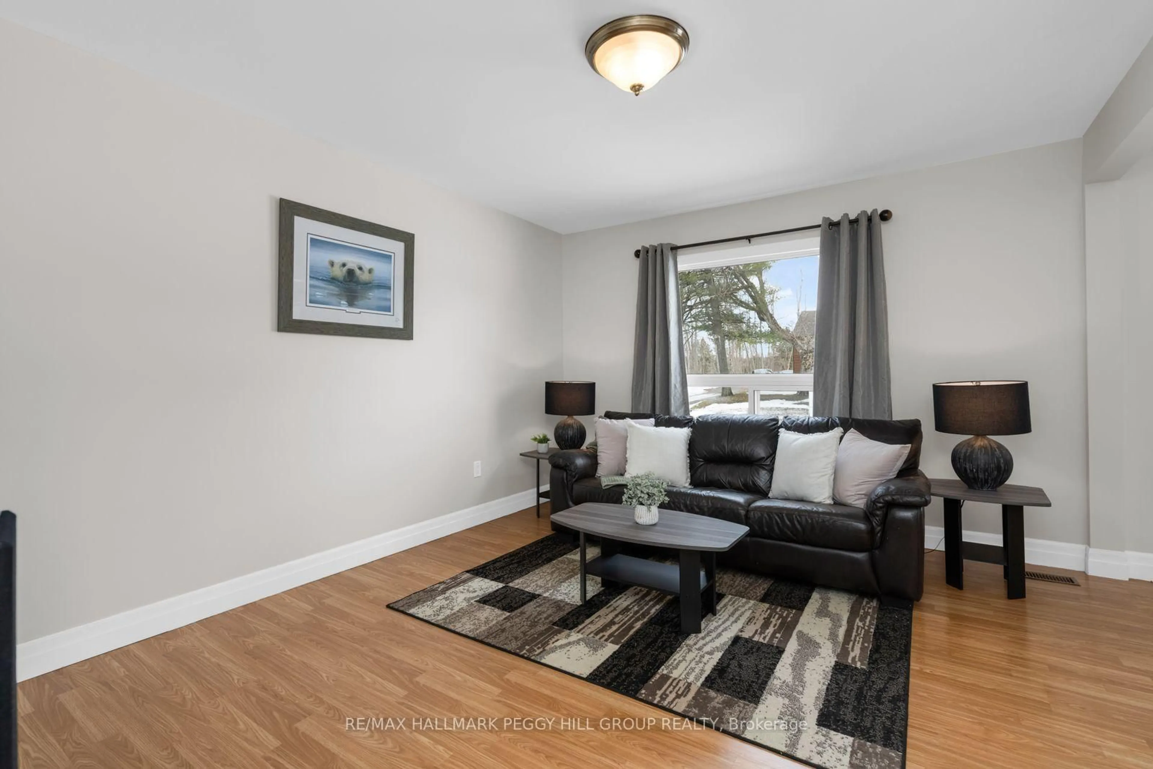 Living room with furniture, wood/laminate floor for 5515 8 Line, Oro-Medonte Ontario L0K 1N0