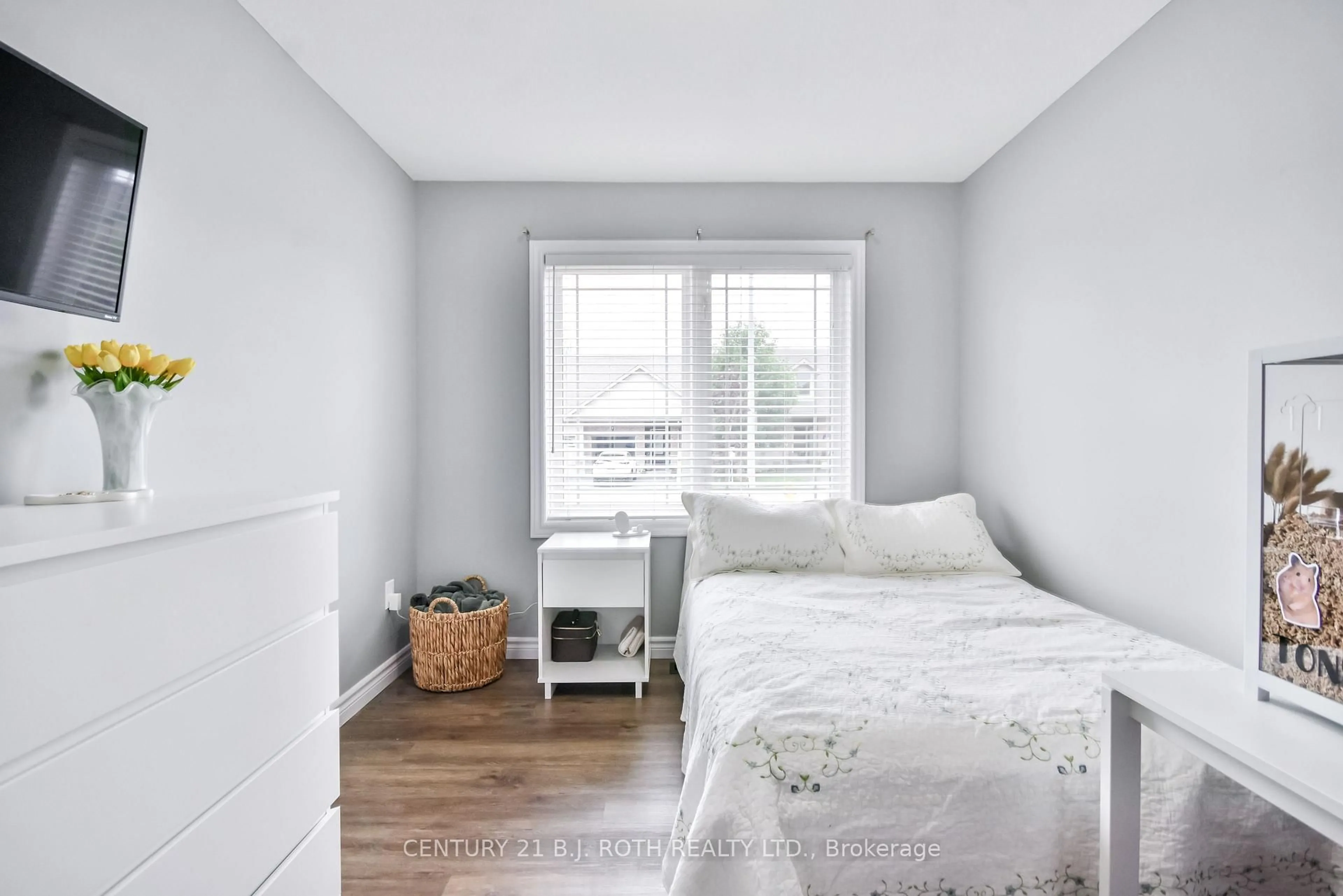 Bedroom with bed, wood/laminate floor for 91 Lucy Lane, Orillia Ontario L3V 0G3