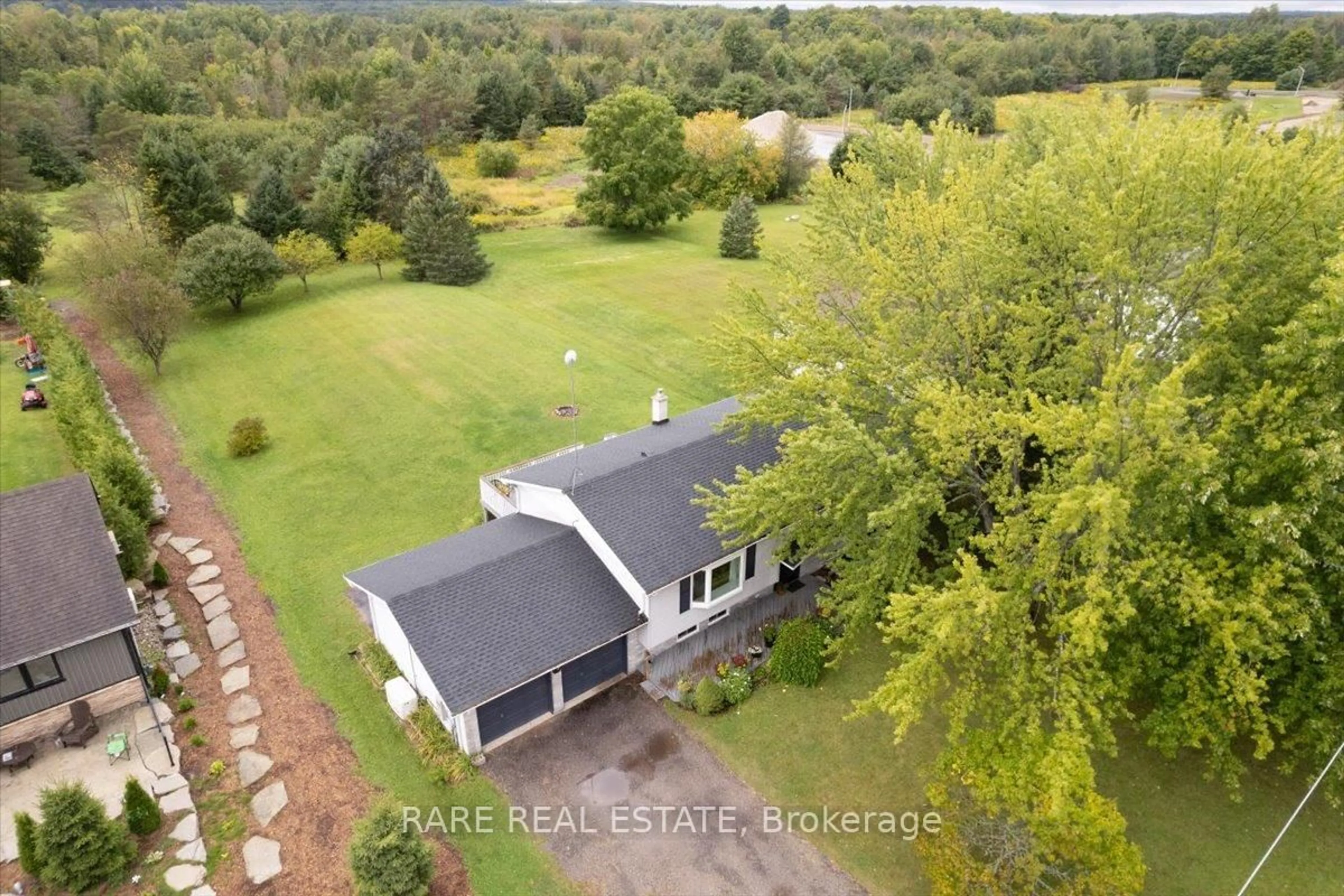 A pic from outside/outdoor area/front of a property/back of a property/a pic from drone, water/lake/river/ocean view for 66 Scarlett Line, Springwater Ontario L0L 1V0