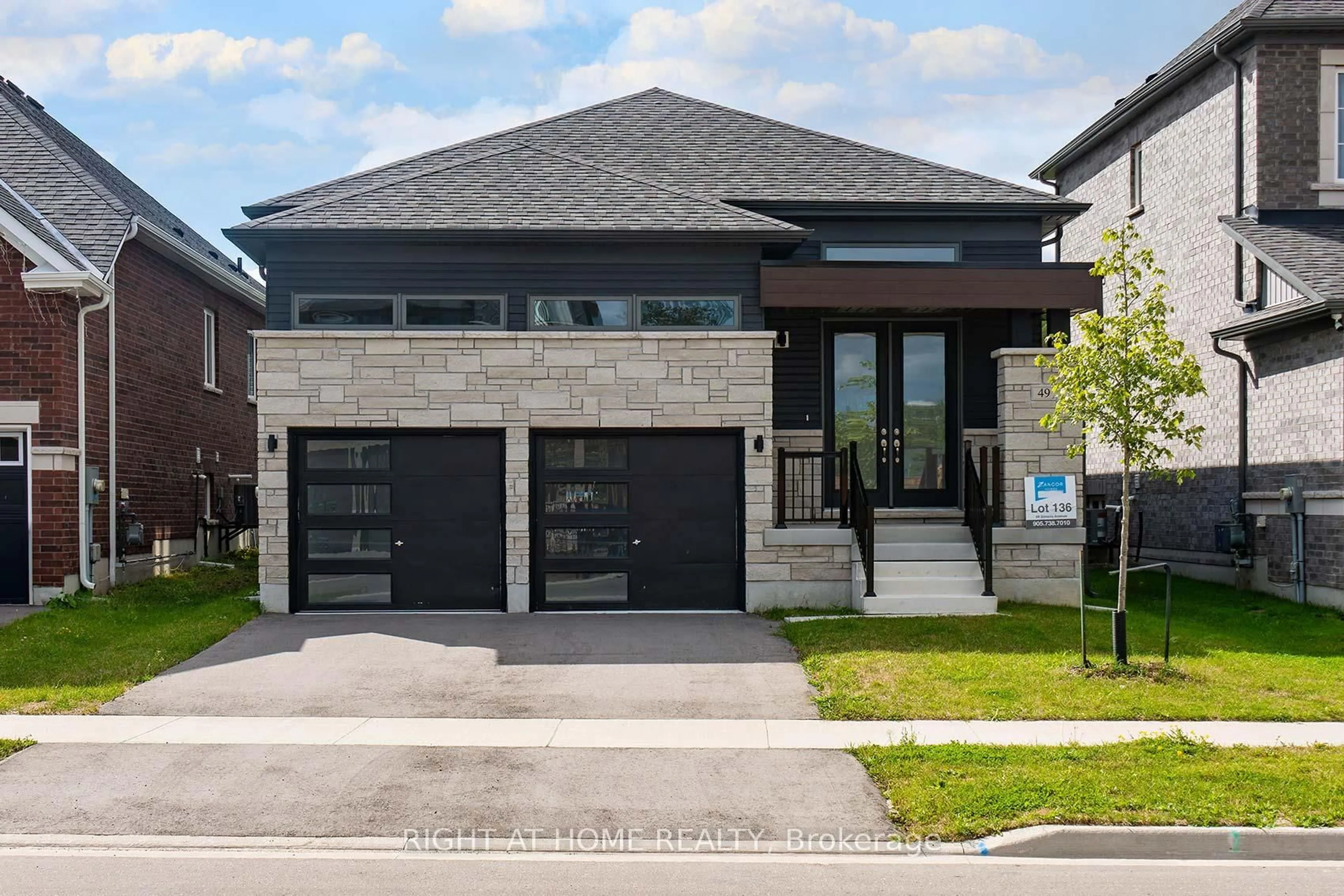 Home with brick exterior material, street for 49 Simona Ave, Wasaga Beach Ontario L9Z 0L3