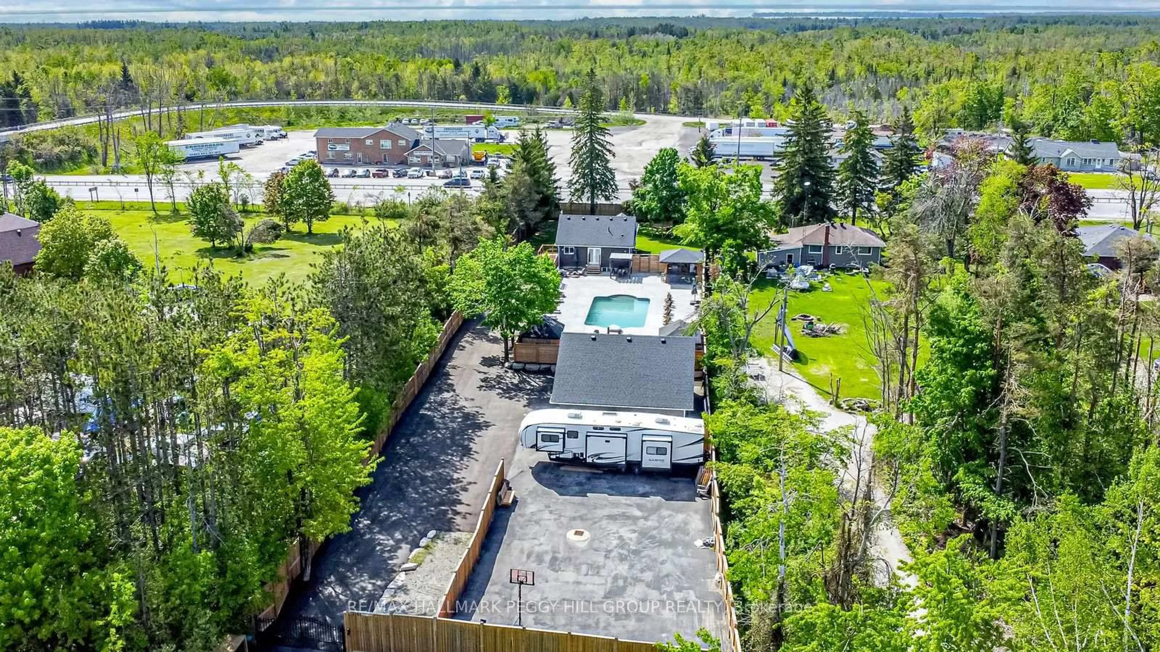 A pic from outside/outdoor area/front of a property/back of a property/a pic from drone, unknown for 2484 Highway 11, Oro-Medonte Ontario L0L 2E0