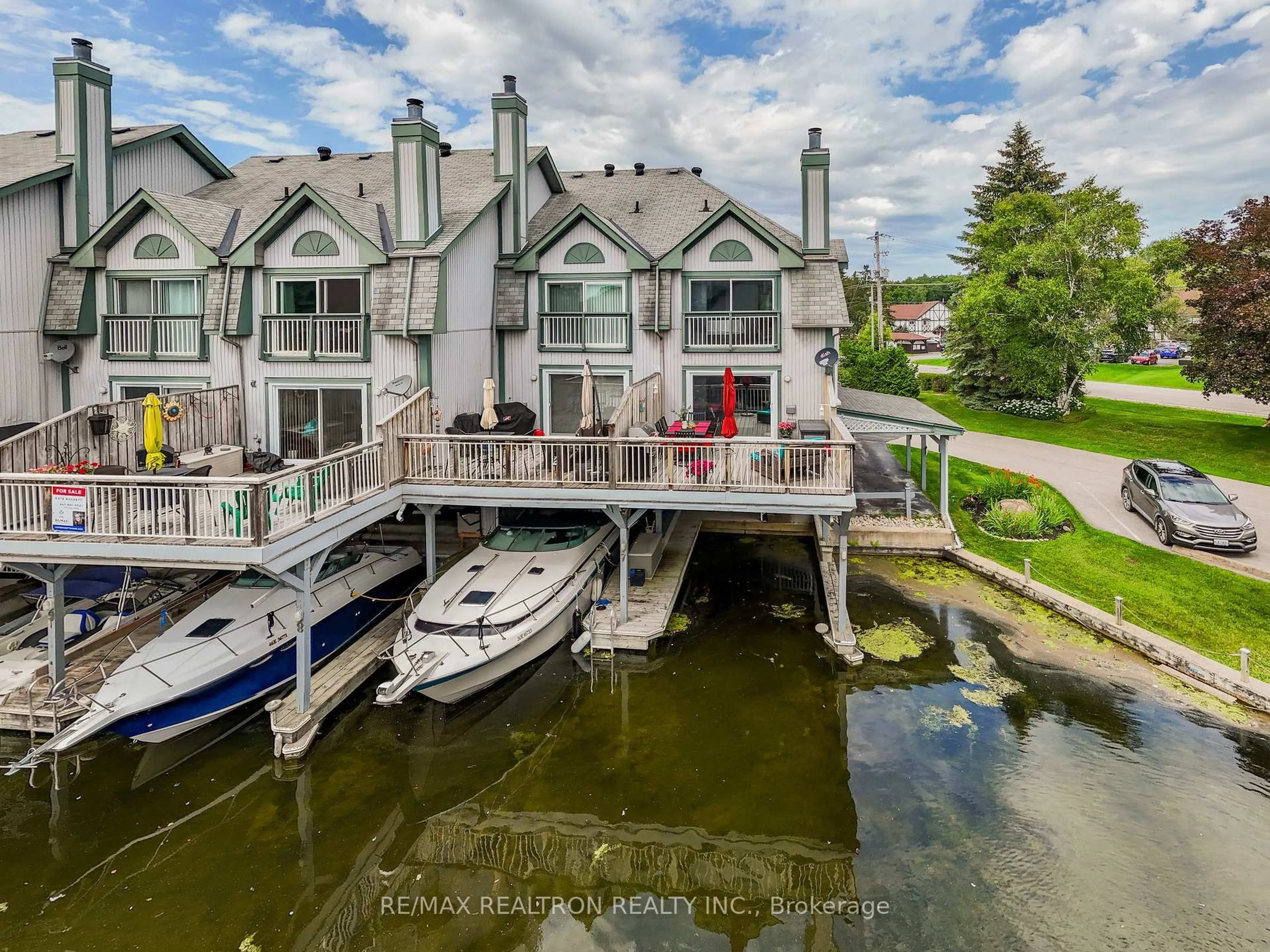 A pic from outside/outdoor area/front of a property/back of a property/a pic from drone, water/lake/river/ocean view for 24 Laguna Pkwy #7, Ramara Ontario L0K 1B0