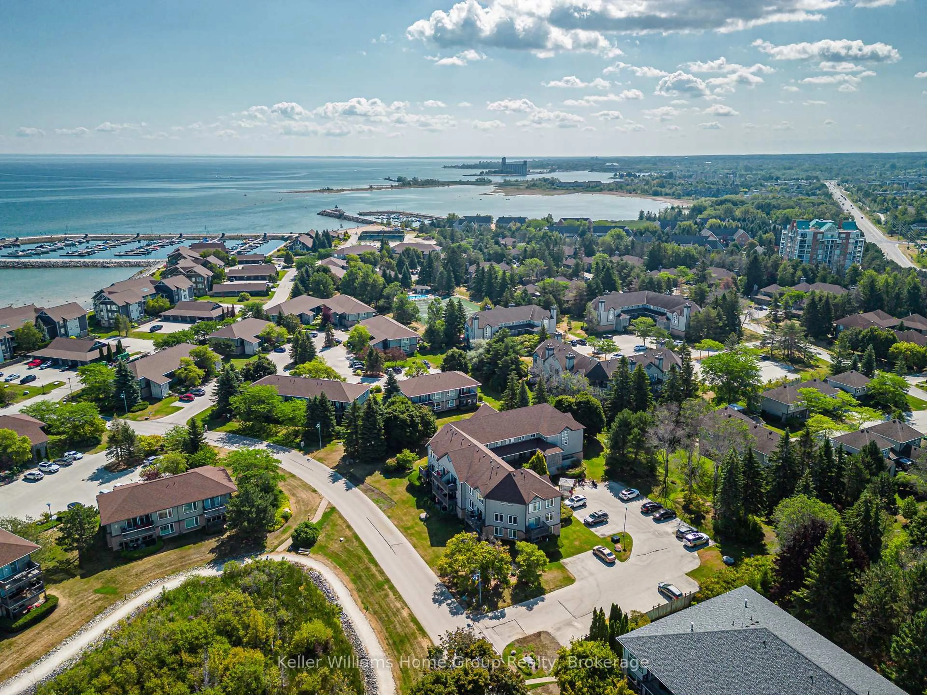 A pic from outside/outdoor area/front of a property/back of a property/a pic from drone, water/lake/river/ocean view for 711 Johnston Park Ave #12, Collingwood Ontario L9Y 5C7