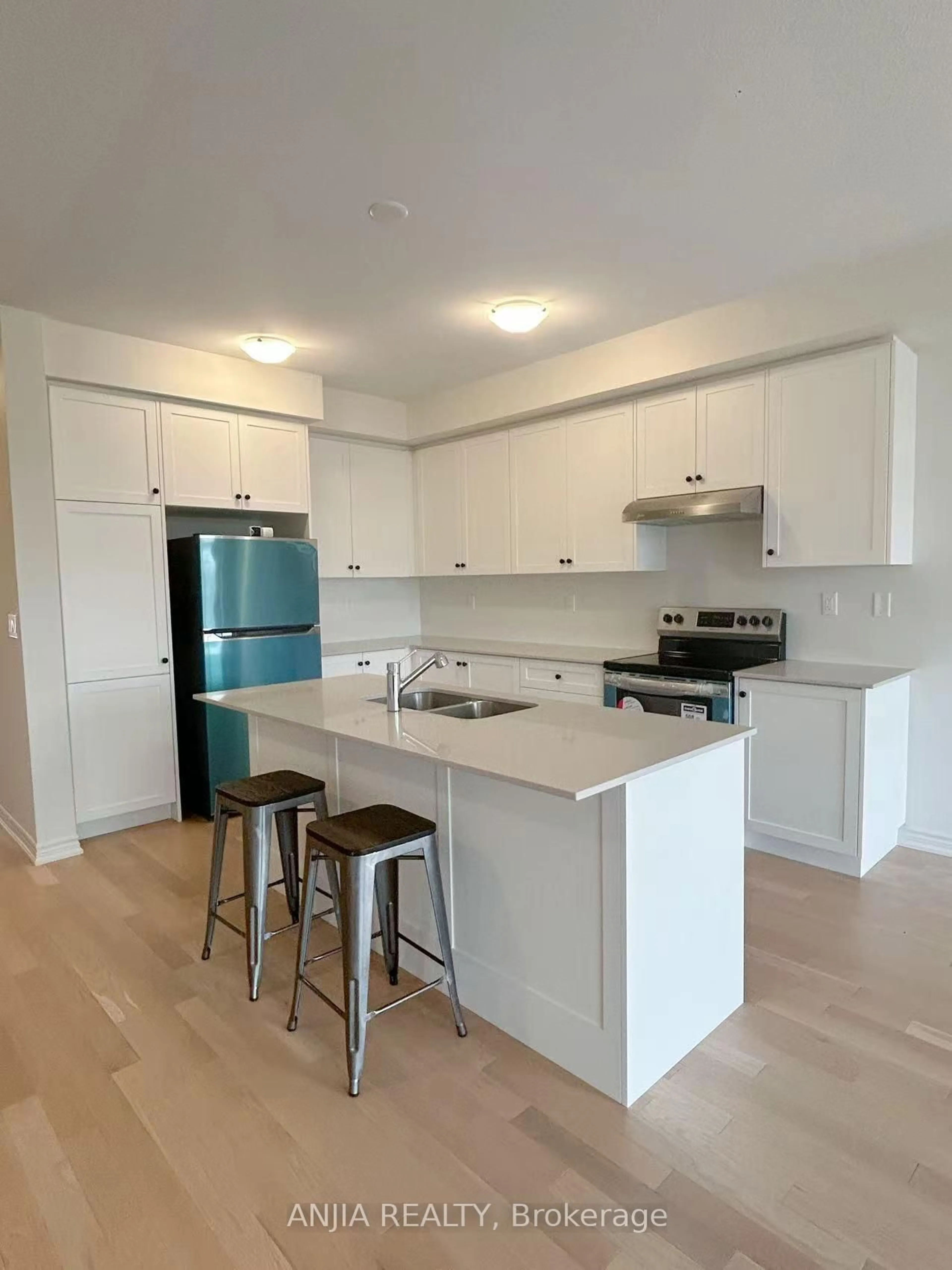 Open concept kitchen, wood/laminate floor for 65 Greer St, Barrie Ontario L9J 0R5