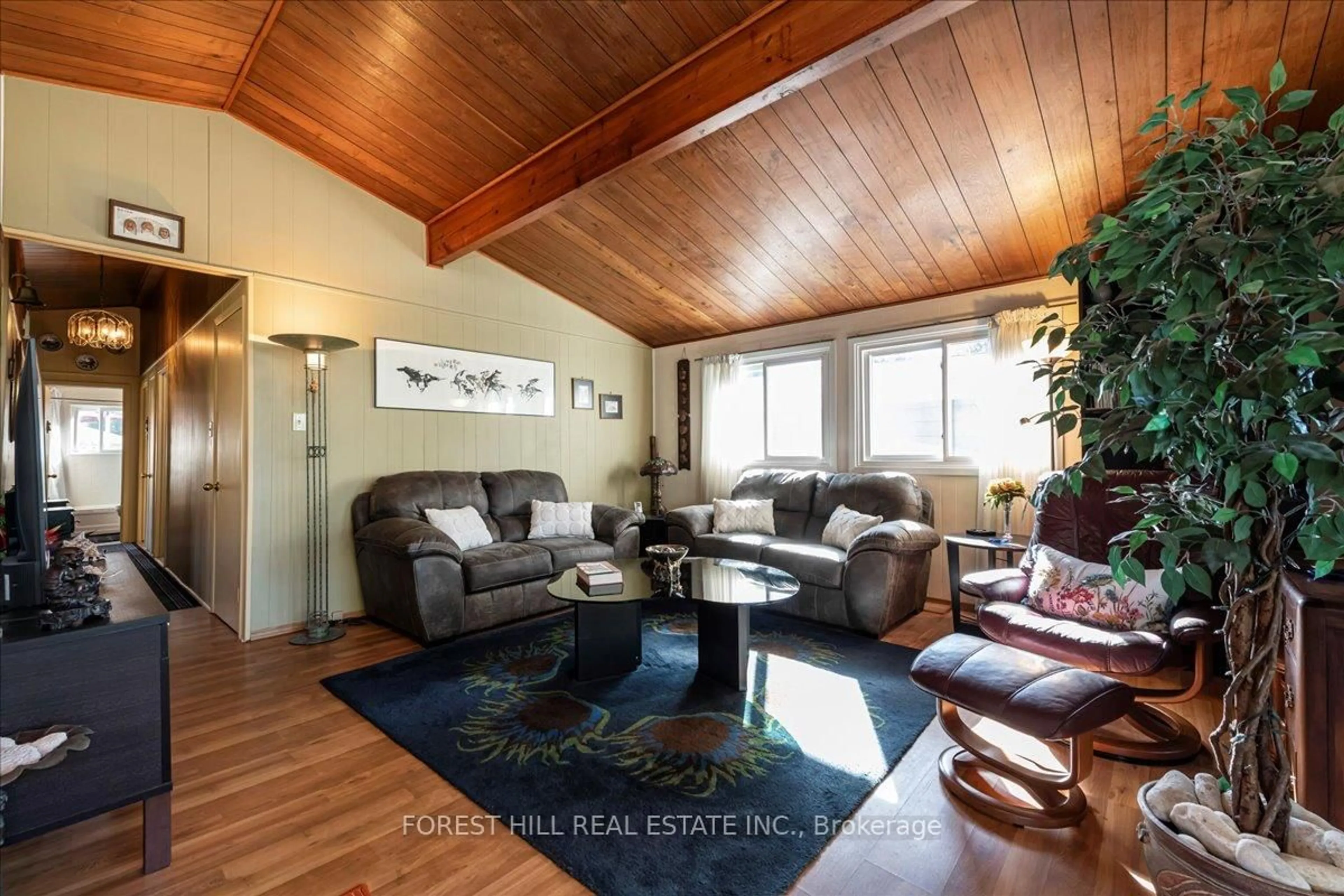 Living room with furniture, wood/laminate floor for 67 Lake Ave, Ramara Ontario L0K 1B0