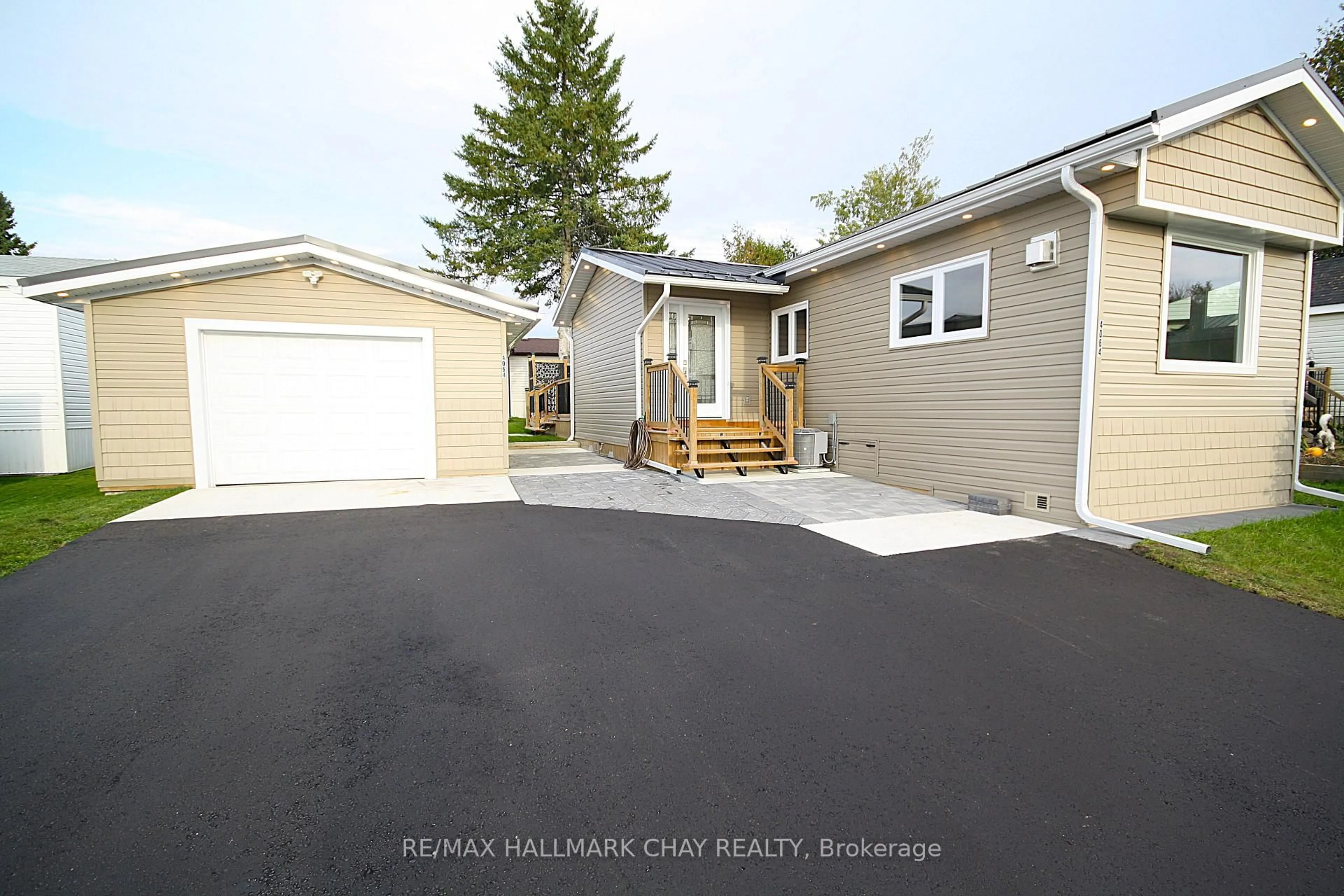 Home with vinyl exterior material, street for 4064 ASH Cres, Severn Ontario L3V 6H4