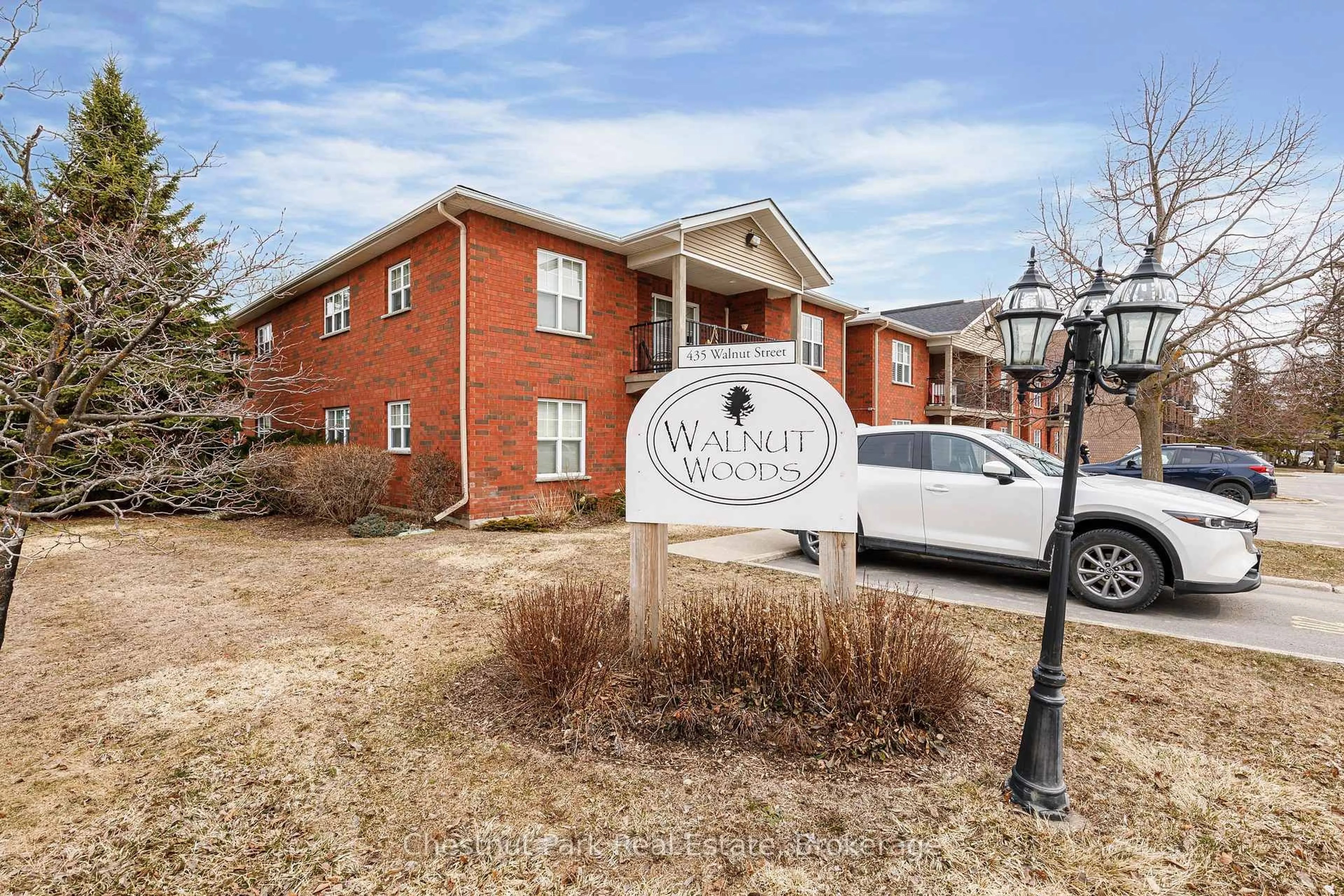 Home with brick exterior material, street for 435 Walnut St #206, Collingwood Ontario L9Y 5J9