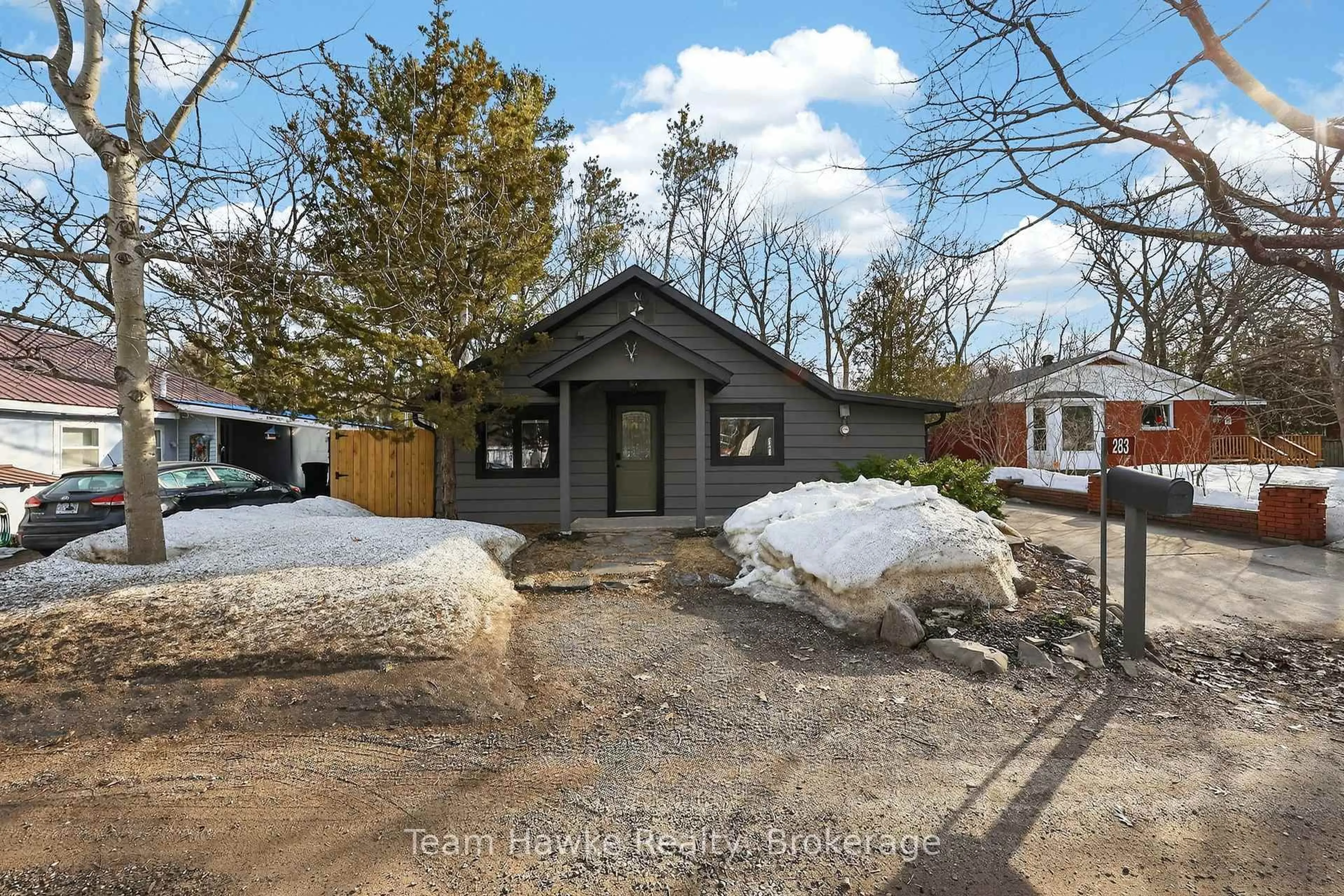 Home with brick exterior material, street for 283 Tiny Beaches Rd, Tiny Ontario L0L 2J0