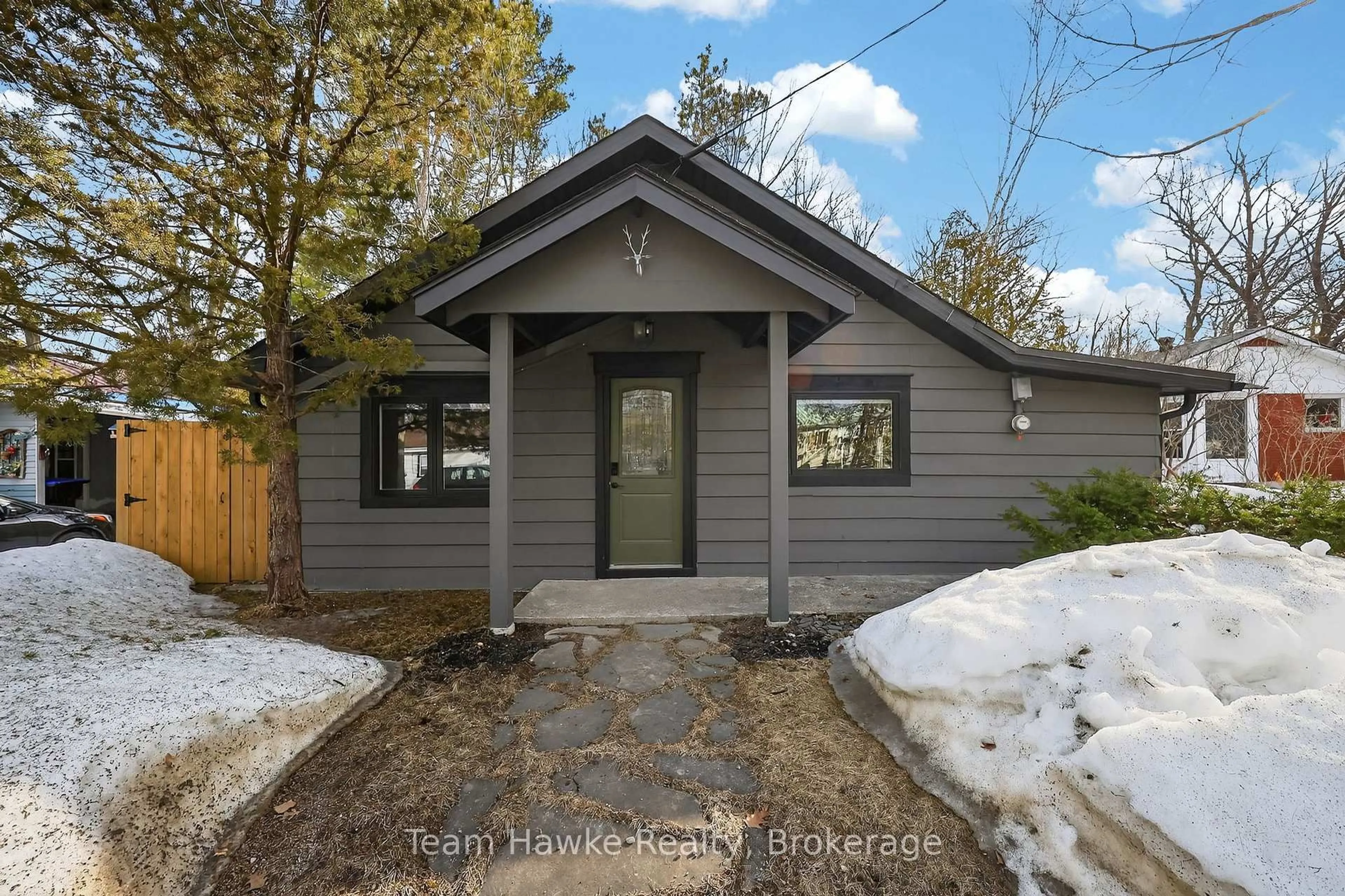 Home with vinyl exterior material, street for 283 Tiny Beaches Rd, Tiny Ontario L0L 2J0