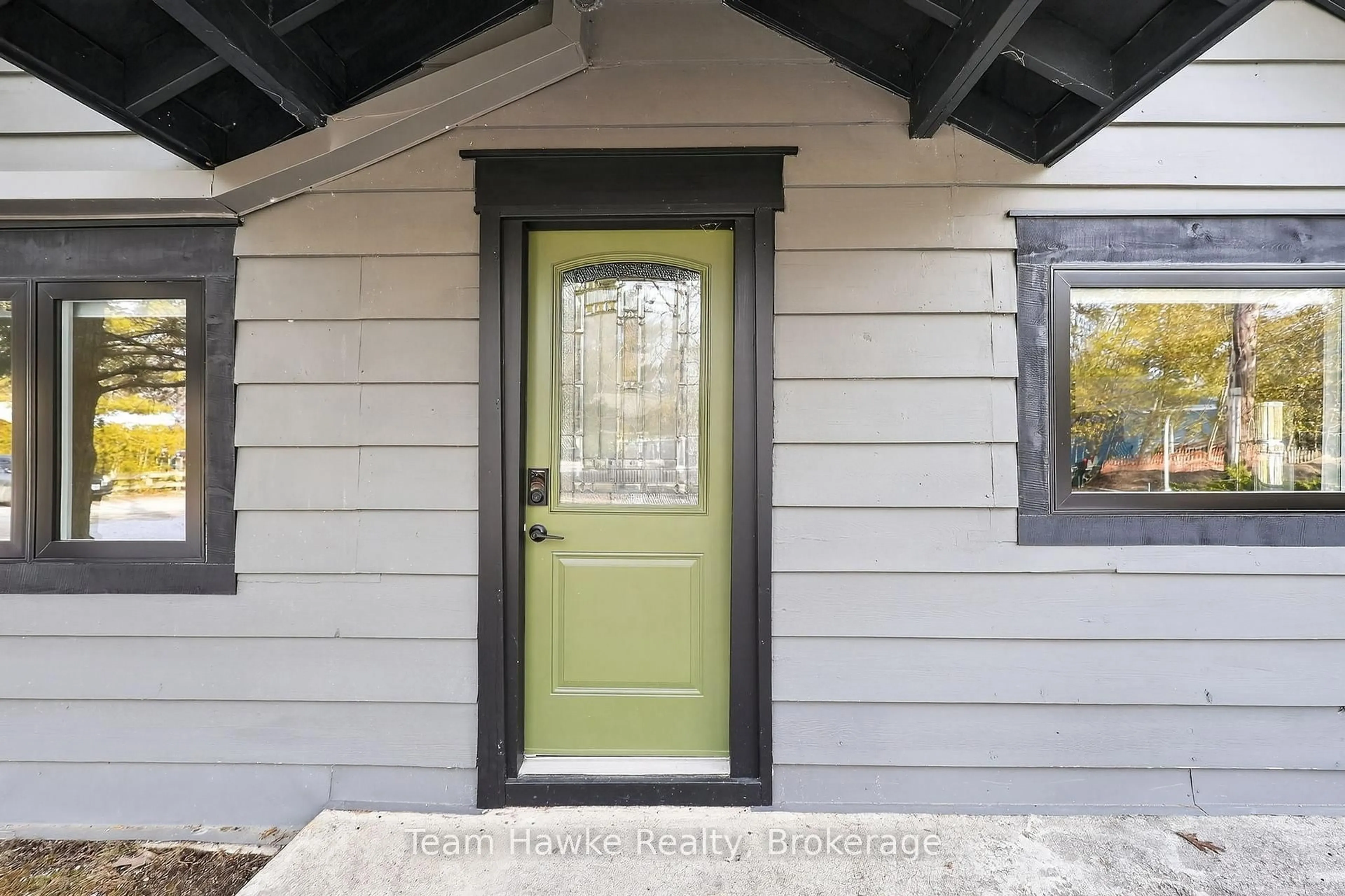 Home with vinyl exterior material, street for 283 Tiny Beaches Rd, Tiny Ontario L0L 2J0