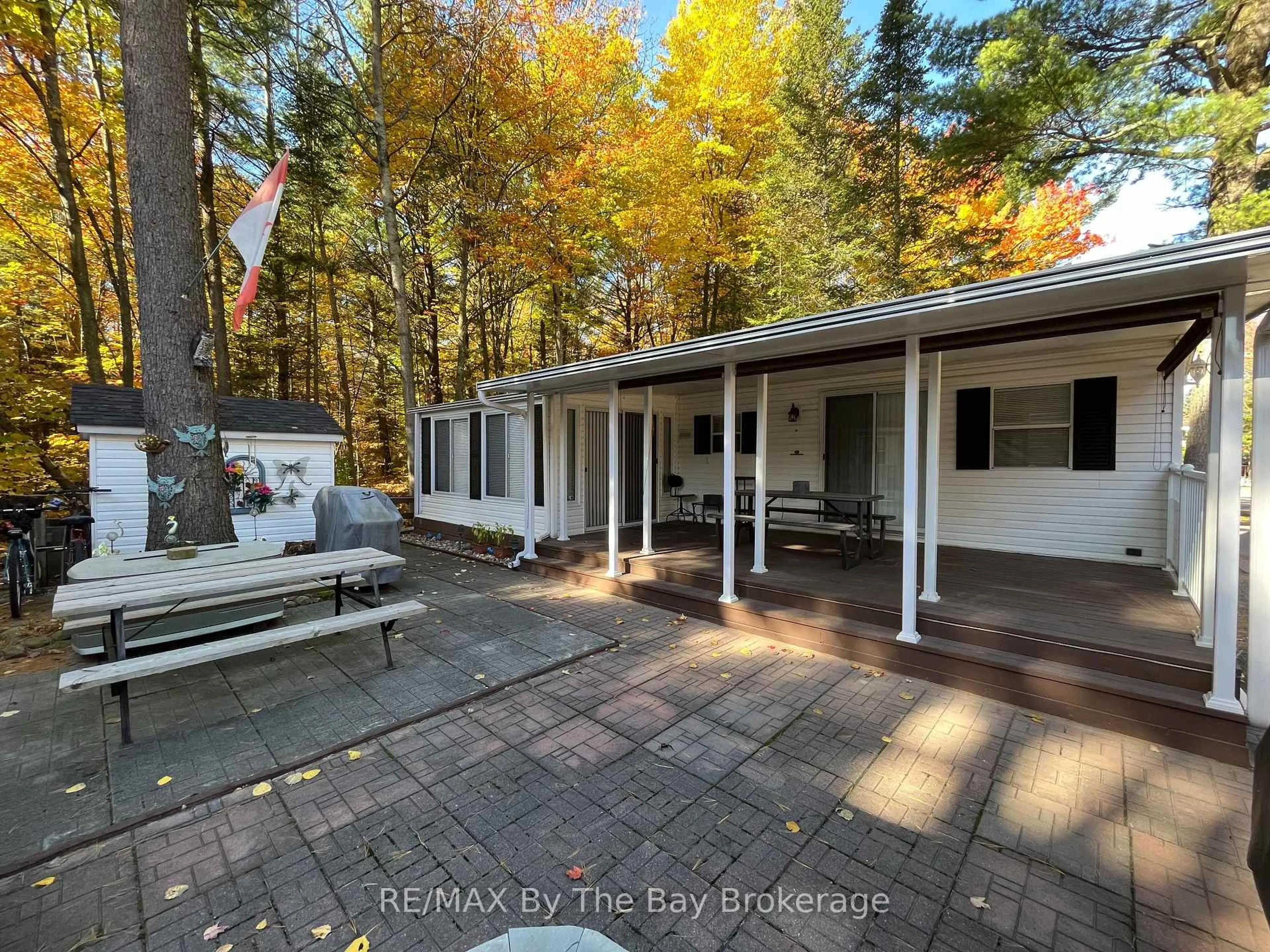 A pic from outside/outdoor area/front of a property/back of a property/a pic from drone, forest/trees view for 85 Theme Park Dr #68, Wasaga Beach Ontario L9Z 1X7