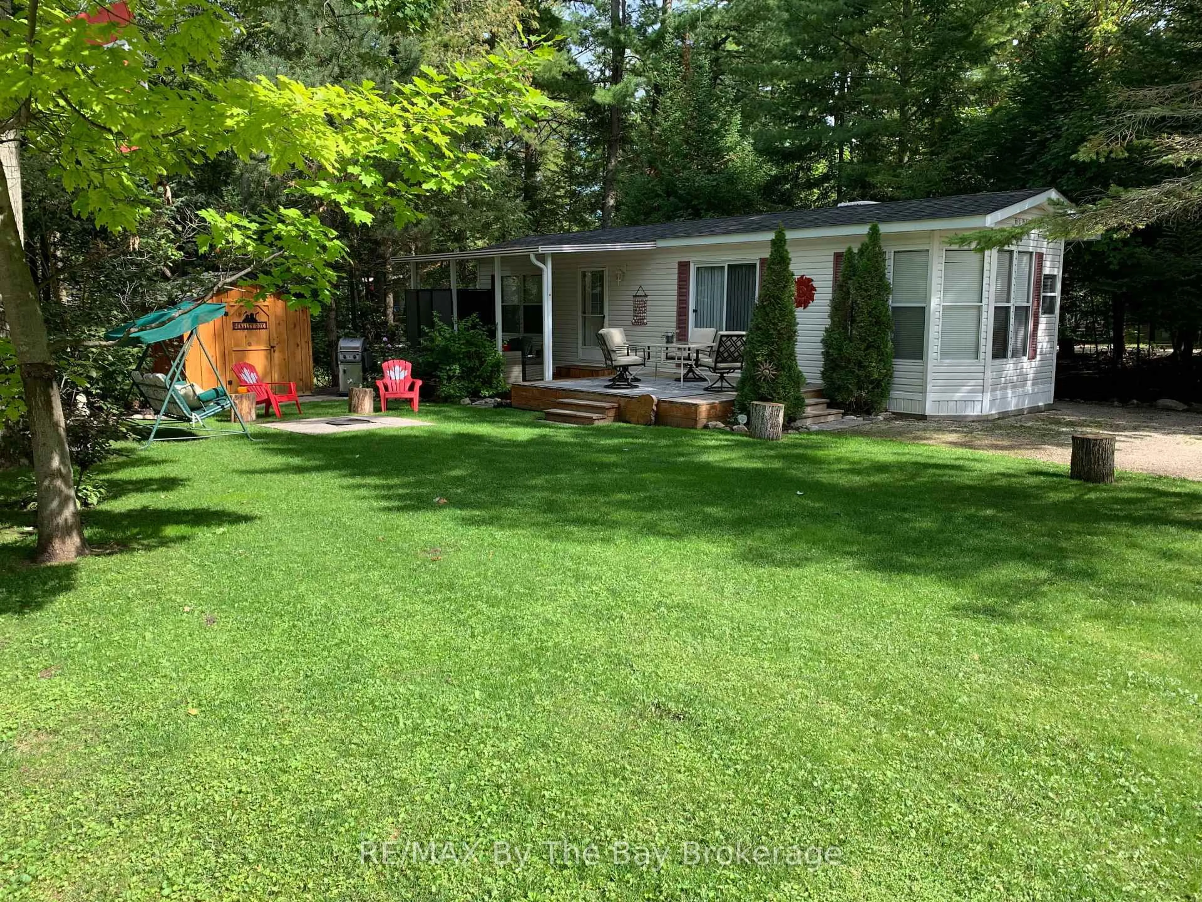 A pic from outside/outdoor area/front of a property/back of a property/a pic from drone, forest/trees view for 85 Theme Park Dr #G4, Wasaga Beach Ontario L9Z 1X7