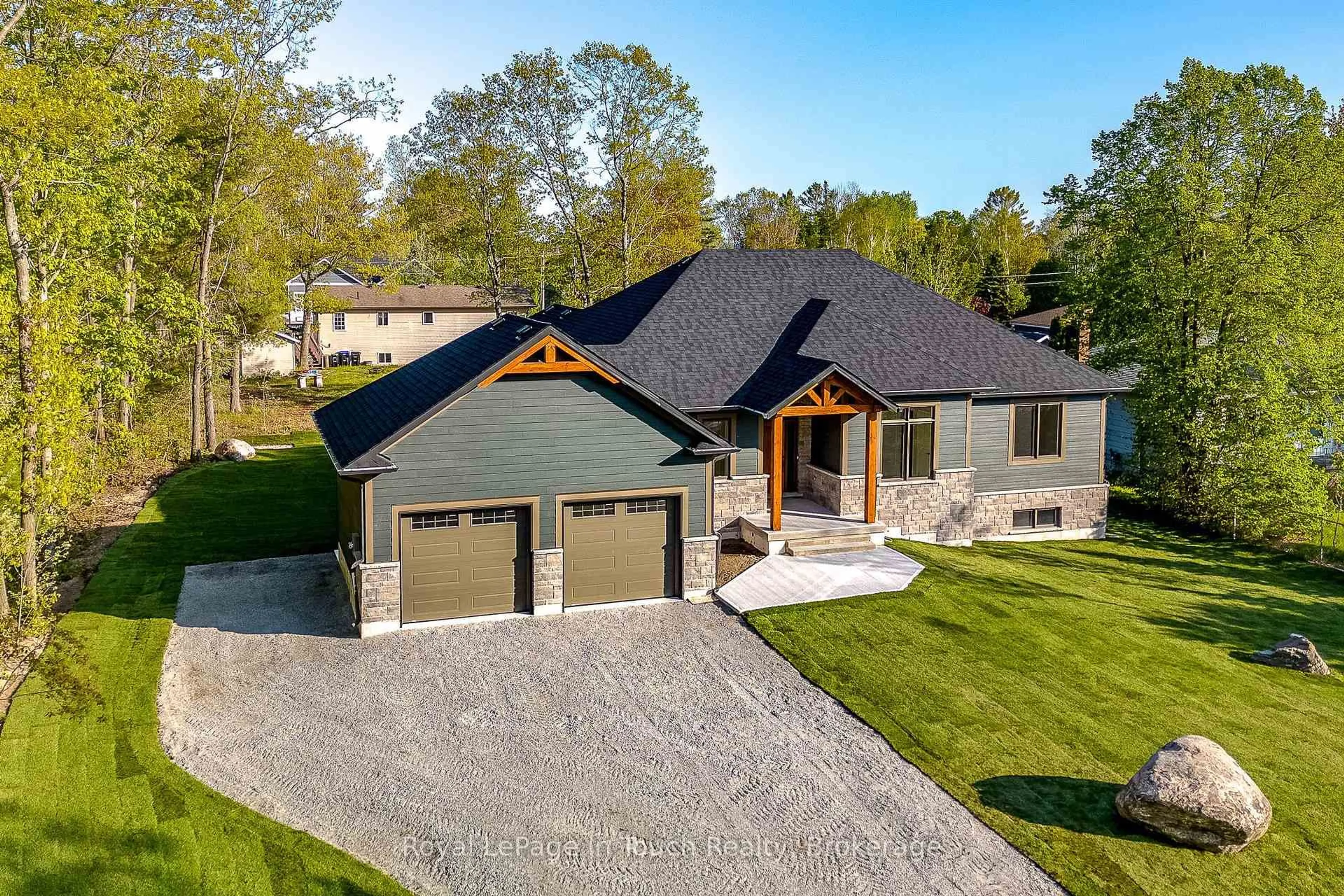 Home with brick exterior material, street for 125 Tall Pines Dr, Tiny Ontario L9M 0H4