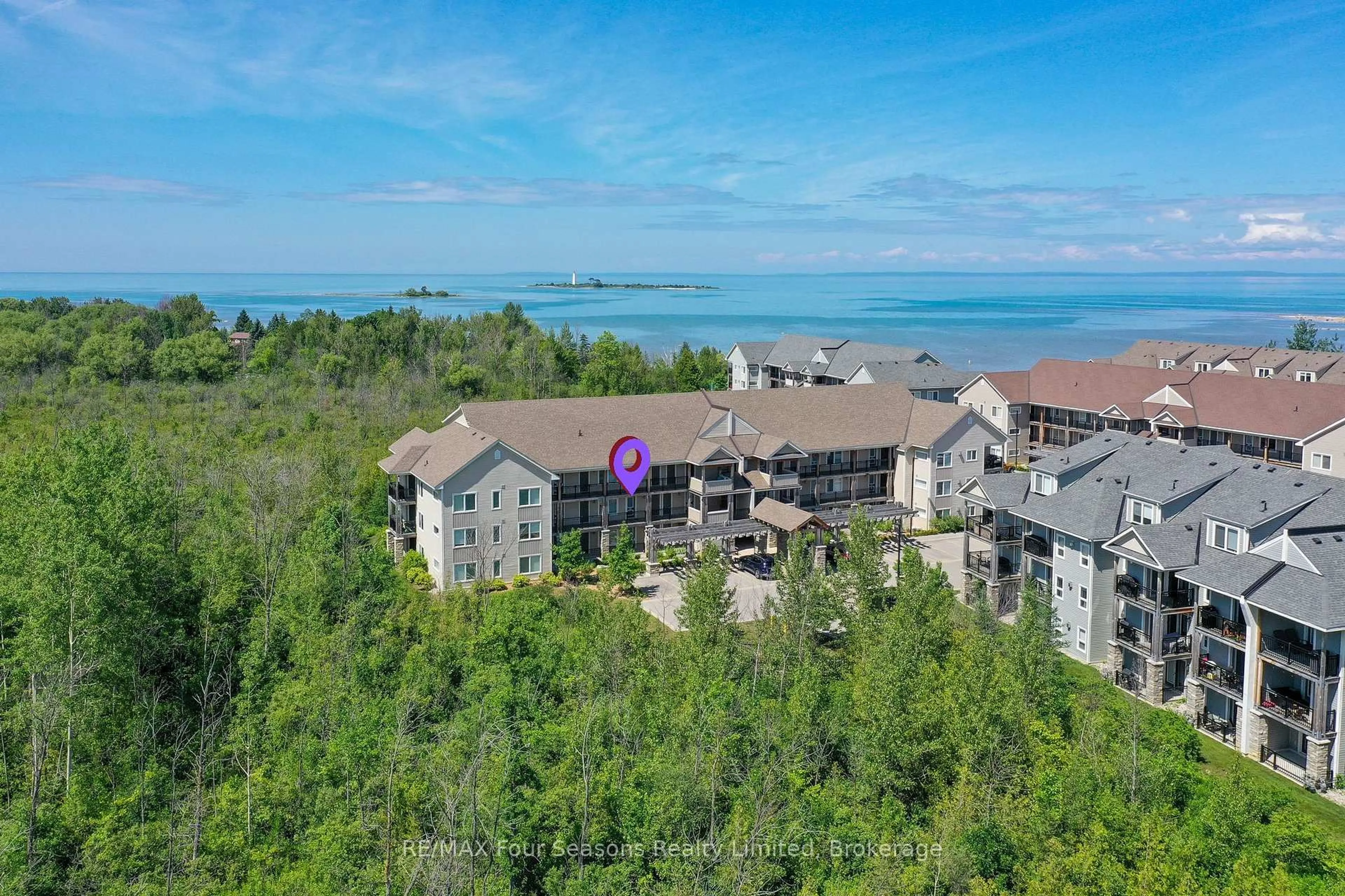 A pic from outside/outdoor area/front of a property/back of a property/a pic from drone, water/lake/river/ocean view for 6 Anchorage Cres #203, Collingwood Ontario L9Y 0Y6