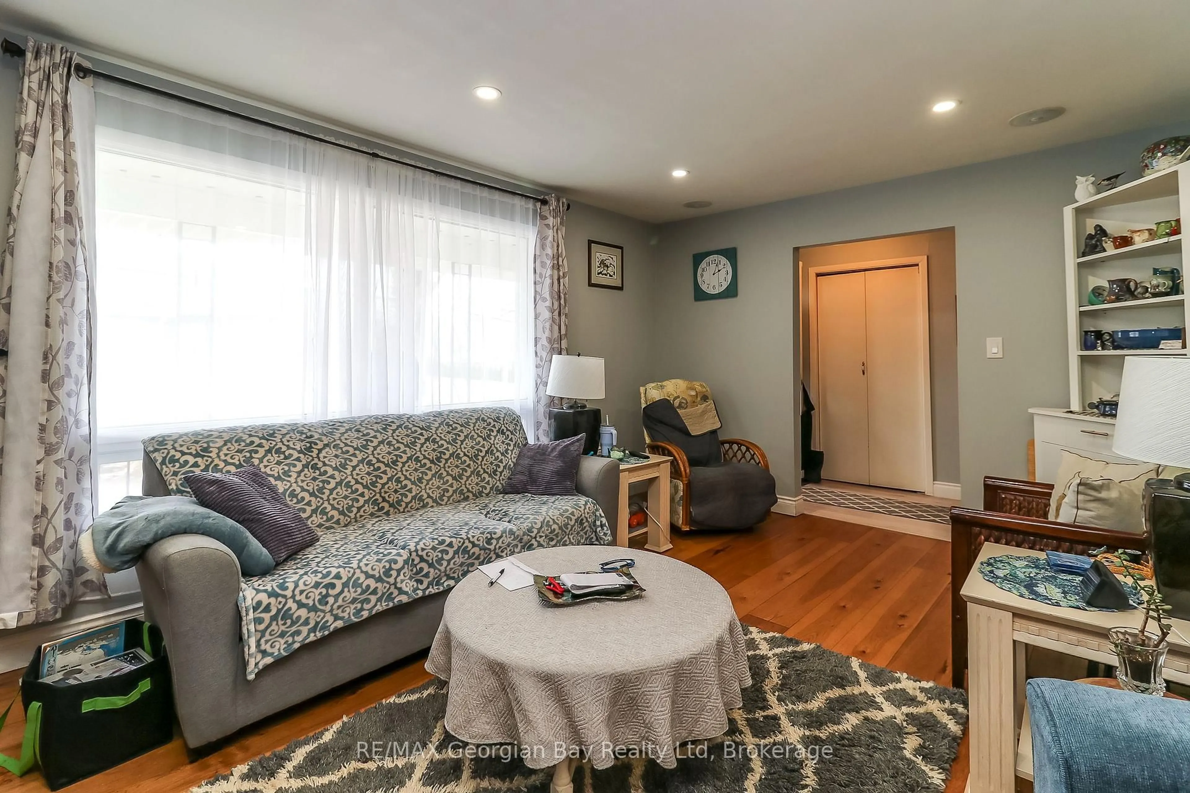 Living room with furniture, wood/laminate floor for 57 MAPLE St, Tay Ontario L0K 2A0