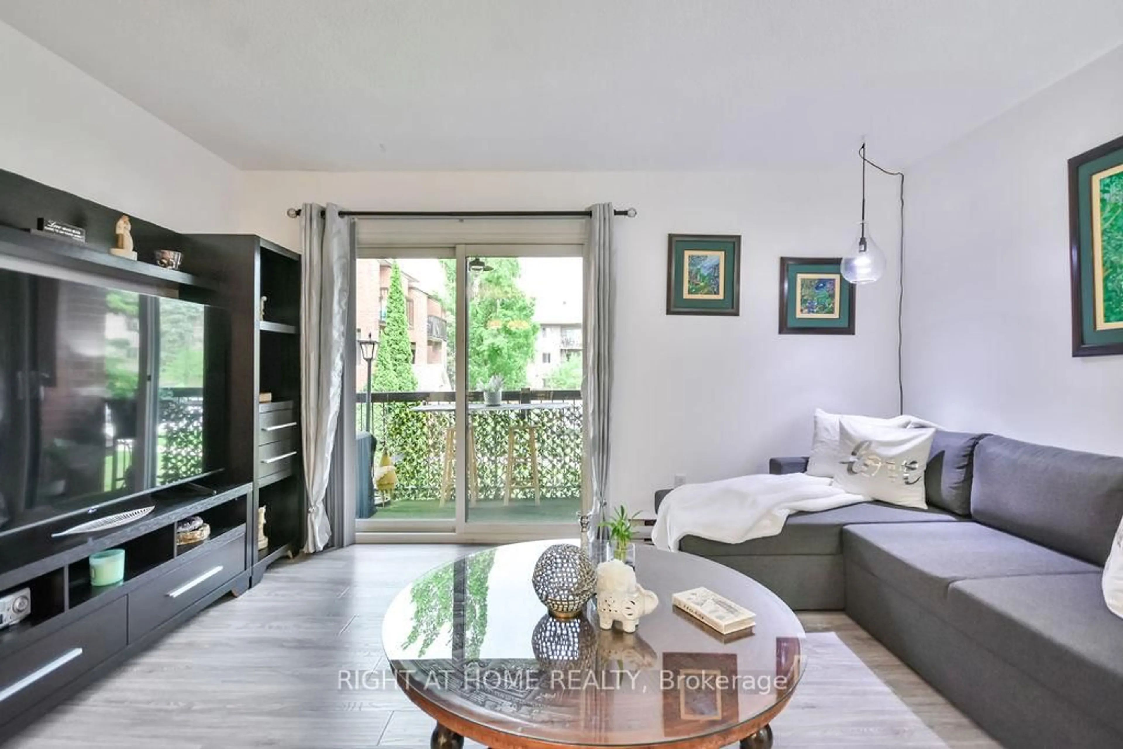 Living room with furniture, wood/laminate floor for 179 Edgehill Dr #B6, Barrie Ontario L4N 1L9