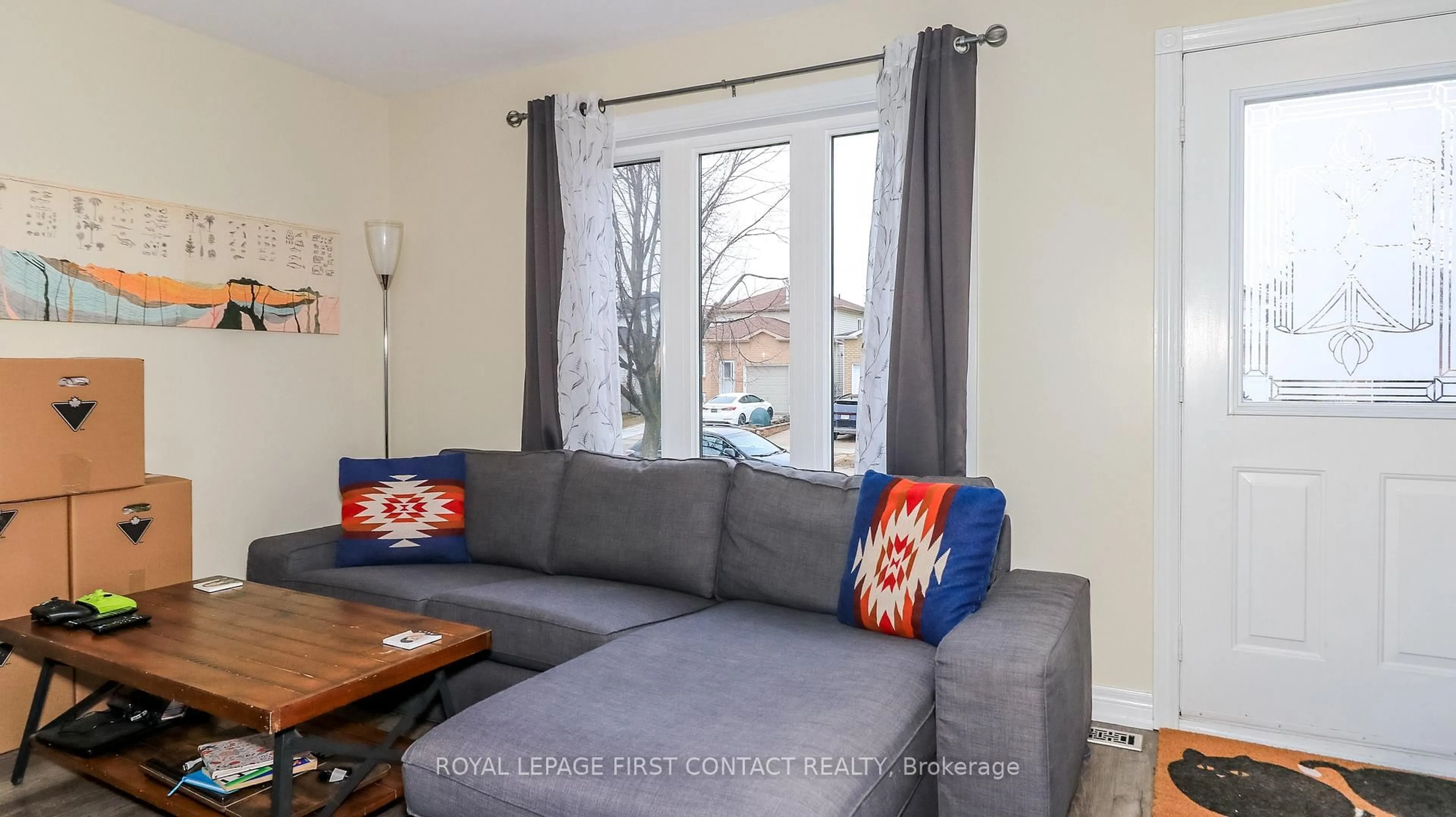 Living room with furniture, wood/laminate floor for 66 Downing Cres, Barrie Ontario L4N 8V5