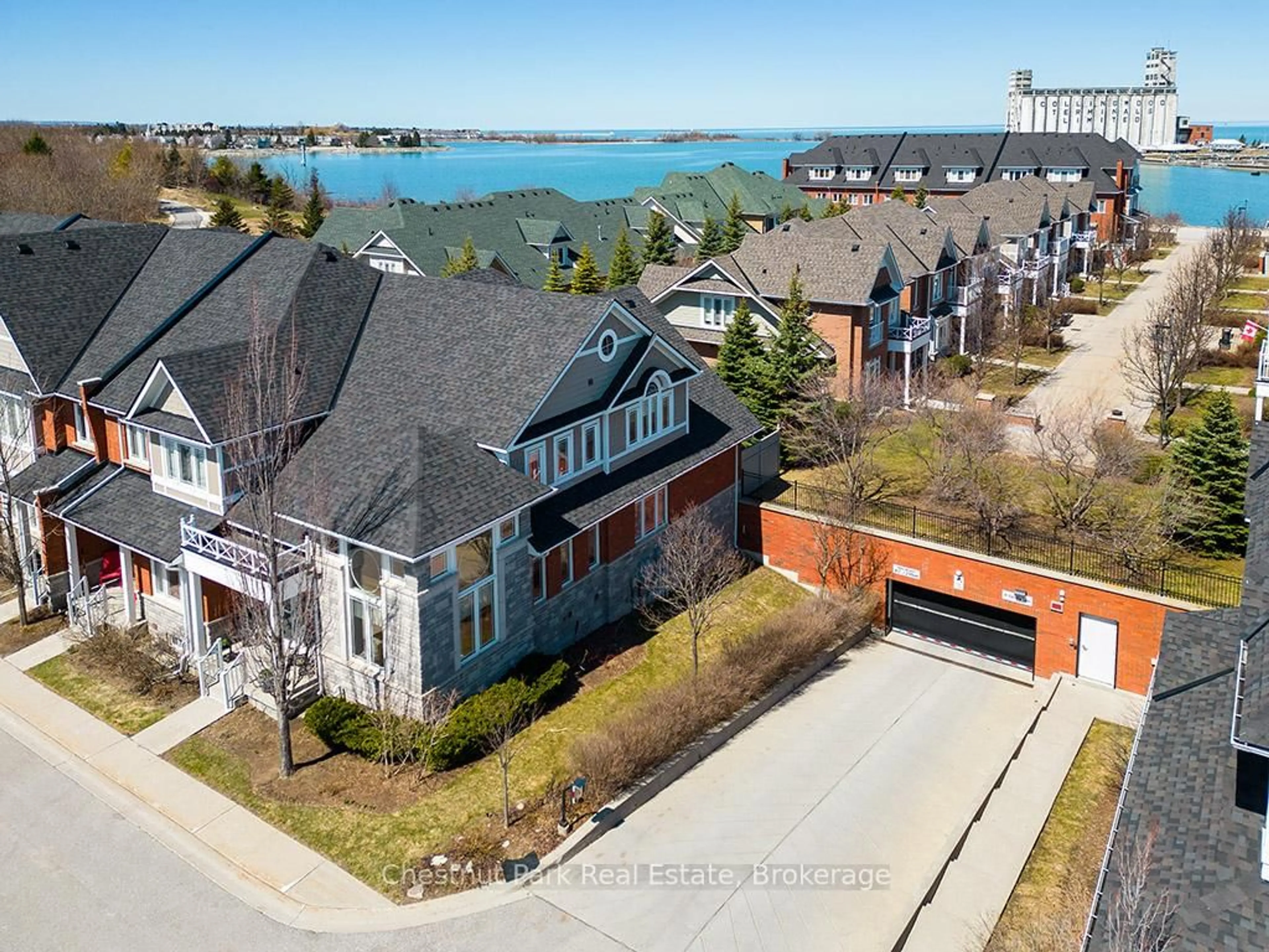 A pic from outside/outdoor area/front of a property/back of a property/a pic from drone, water/lake/river/ocean view for 13 Collship Lane, Collingwood Ontario L9Y 0J6