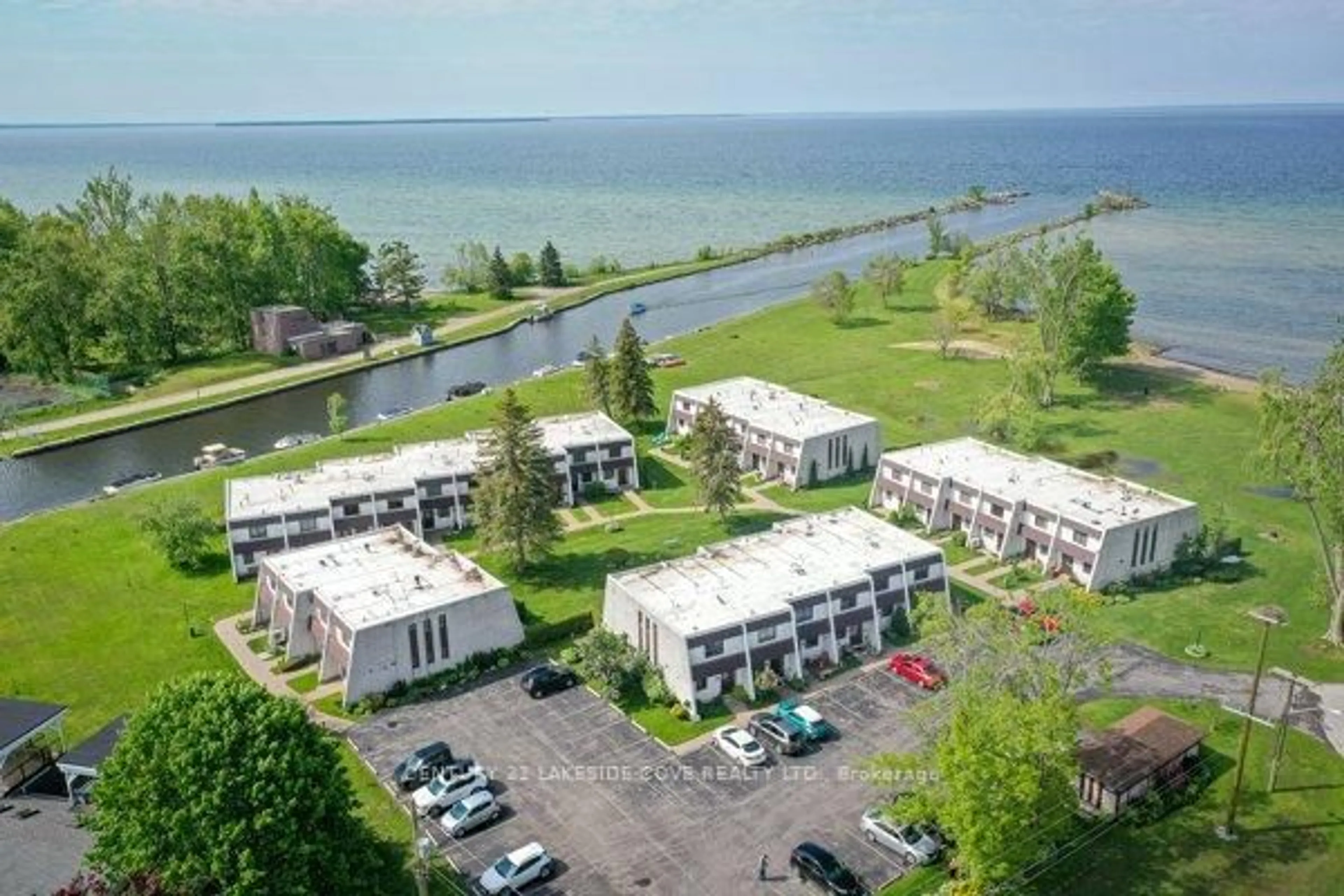 A pic from outside/outdoor area/front of a property/back of a property/a pic from drone, water/lake/river/ocean view for 1 Paradise Blvd #Unit 14, Ramara Ontario L0K 1B0