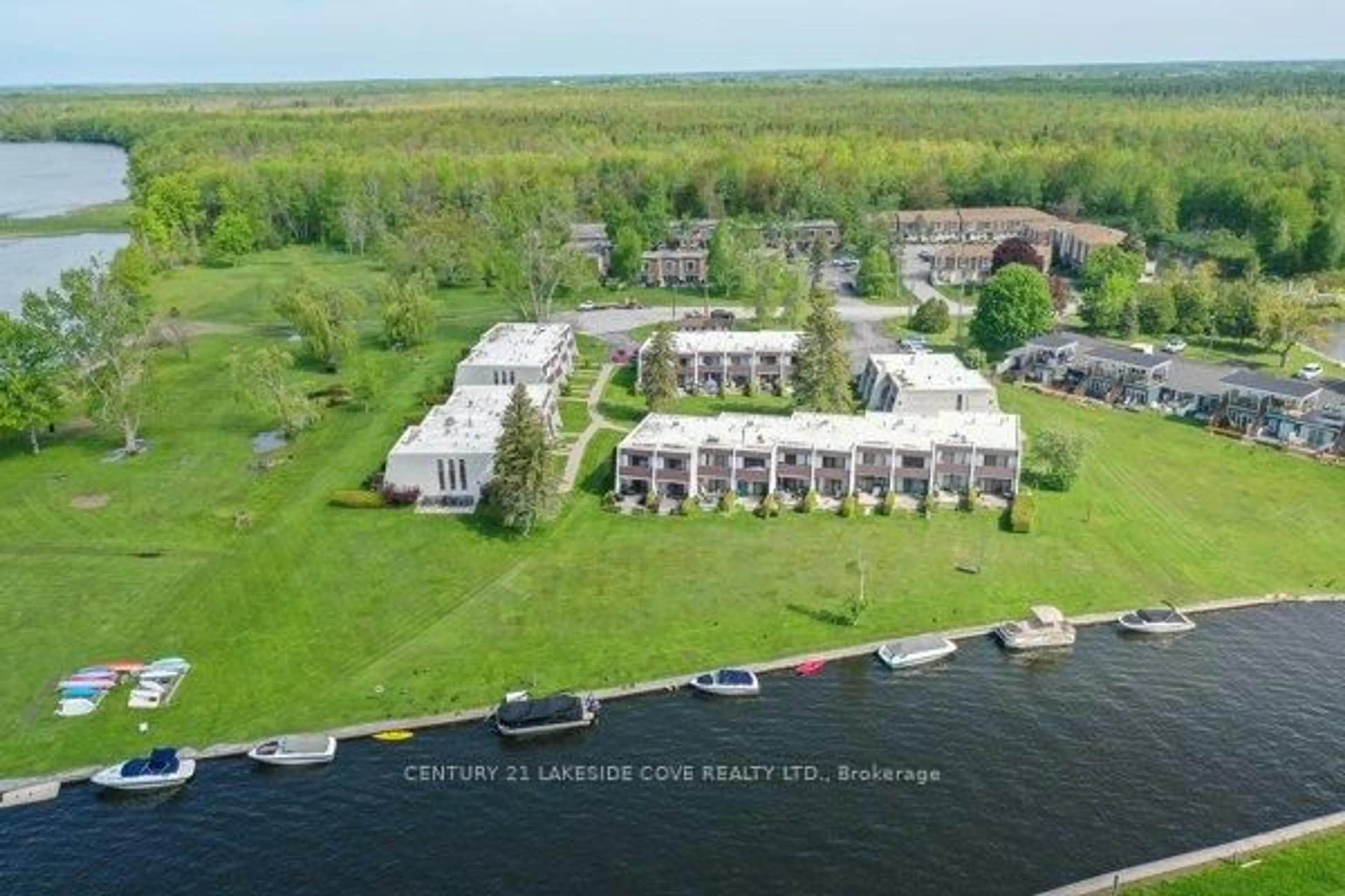 A pic from outside/outdoor area/front of a property/back of a property/a pic from drone, water/lake/river/ocean view for 1 Paradise Blvd #Unit 14, Ramara Ontario L0K 1B0