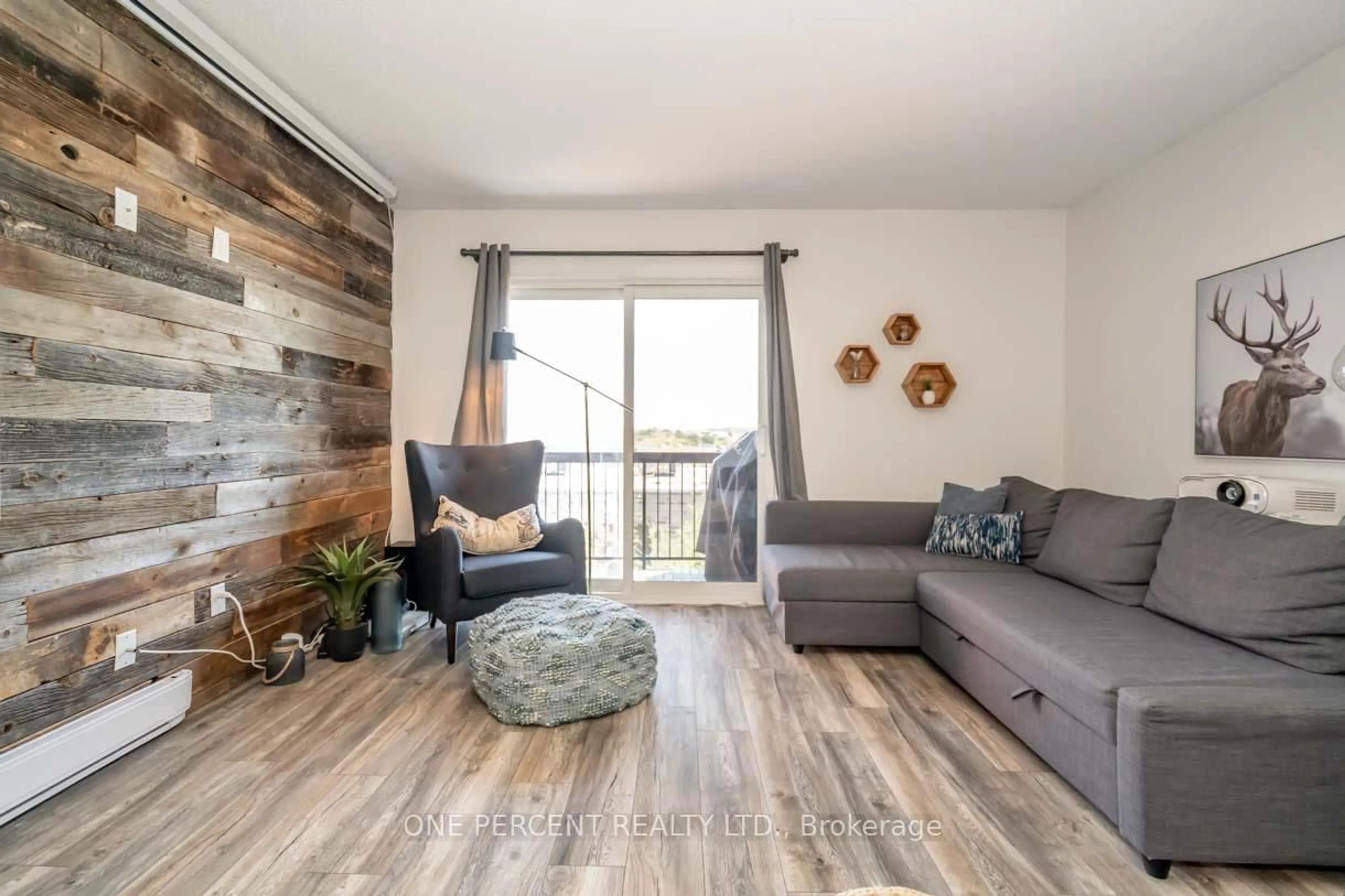 Living room with furniture, wood/laminate floor for 171 Edgehill Dr #F11, Barrie Ontario L4N 1L9