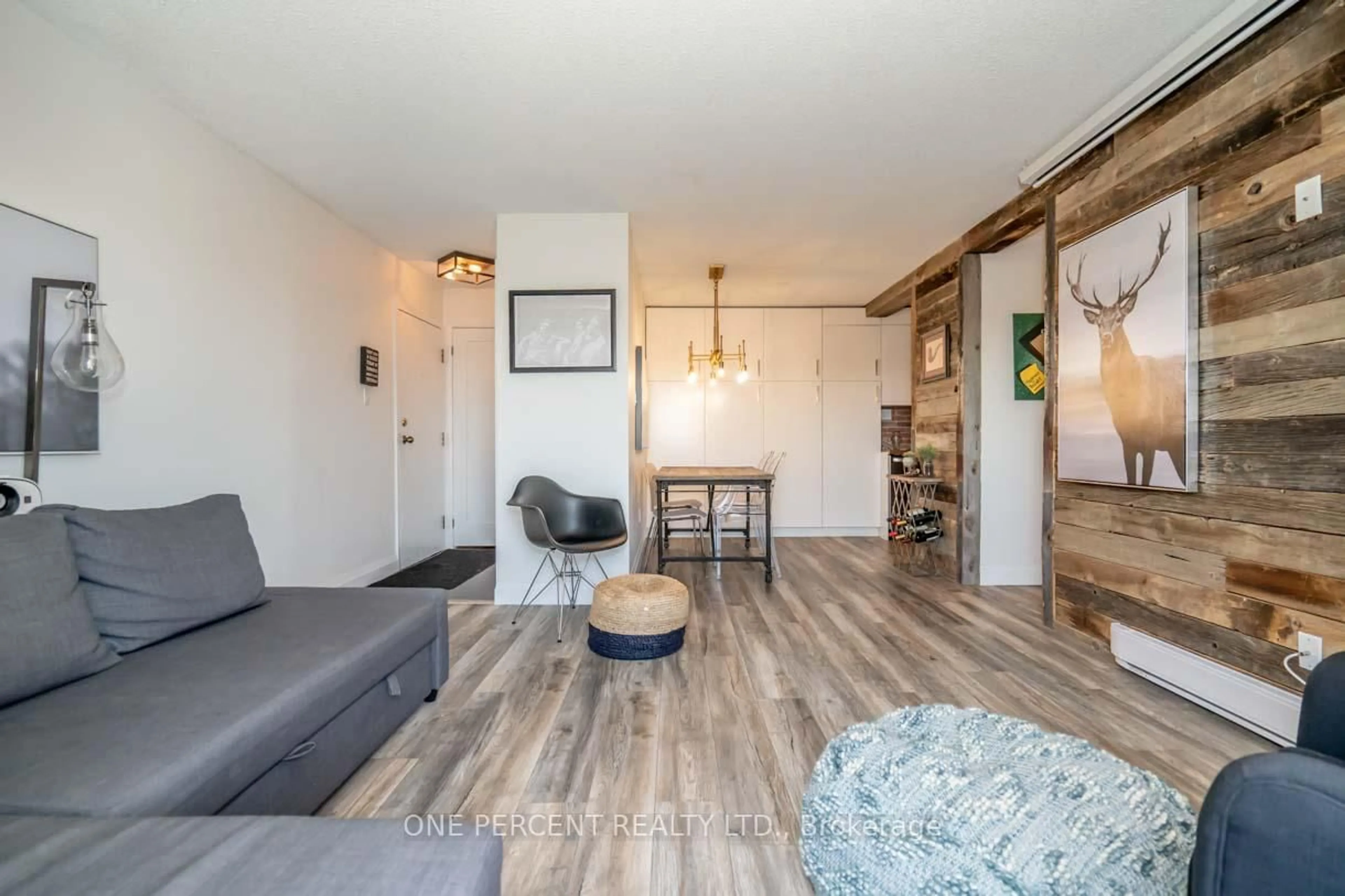 Living room with furniture, wood/laminate floor for 171 Edgehill Dr #F11, Barrie Ontario L4N 1L9