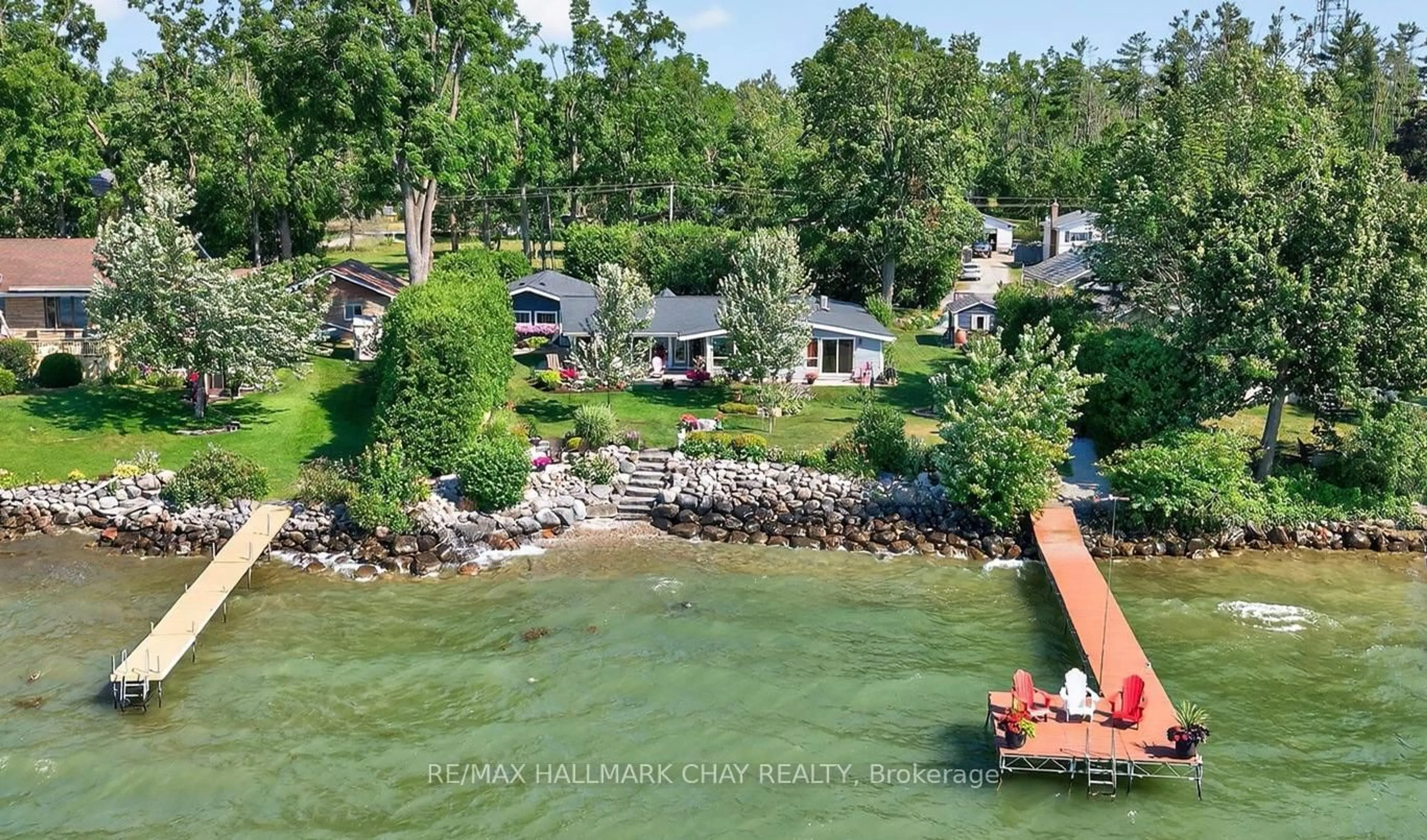 A pic from outside/outdoor area/front of a property/back of a property/a pic from drone, water/lake/river/ocean view for 7 Lakeshore Rd, Oro-Medonte Ontario L0L 2E0