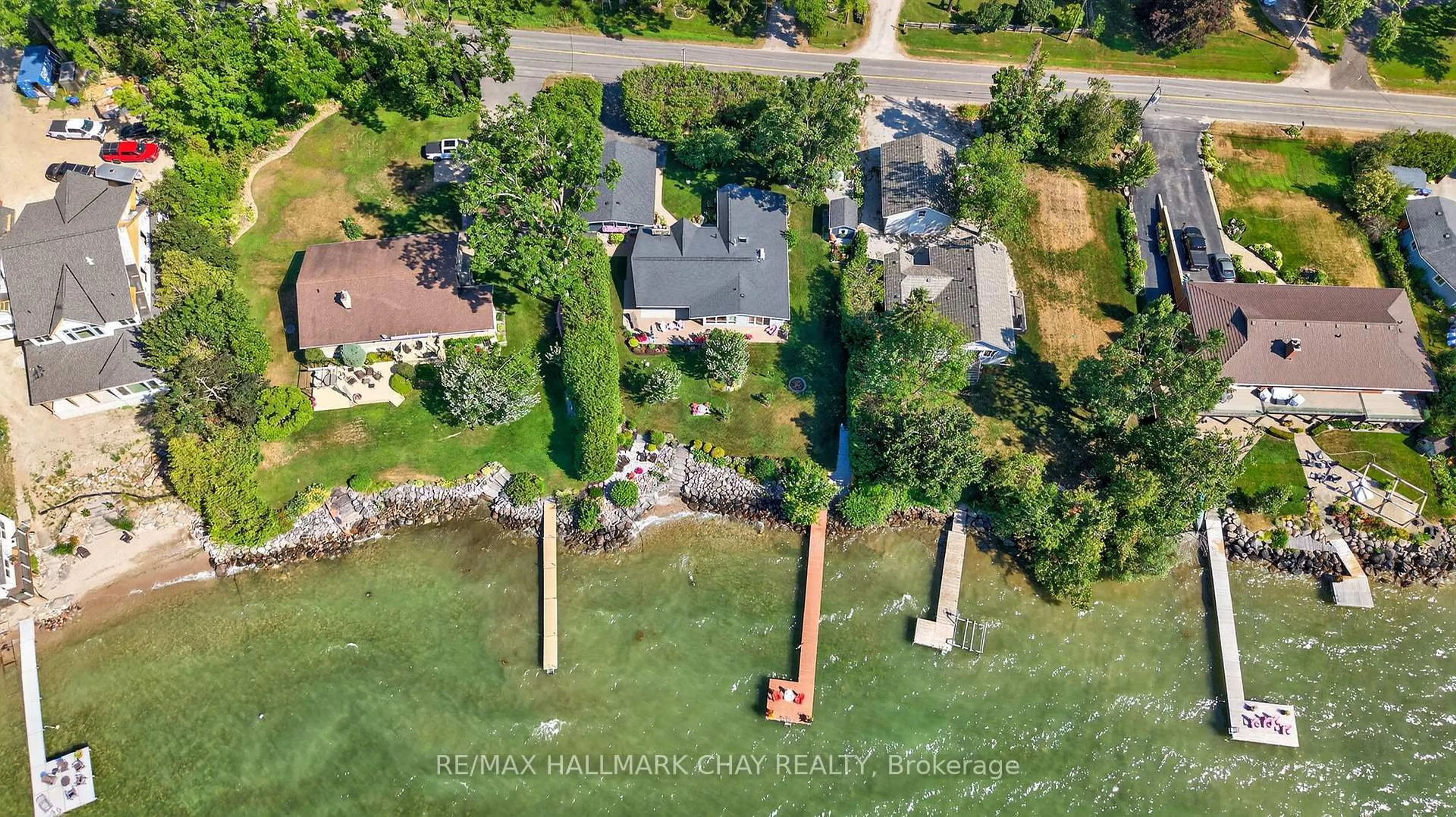 A pic from outside/outdoor area/front of a property/back of a property/a pic from drone, water/lake/river/ocean view for 7 Lakeshore Rd, Oro-Medonte Ontario L0L 2E0