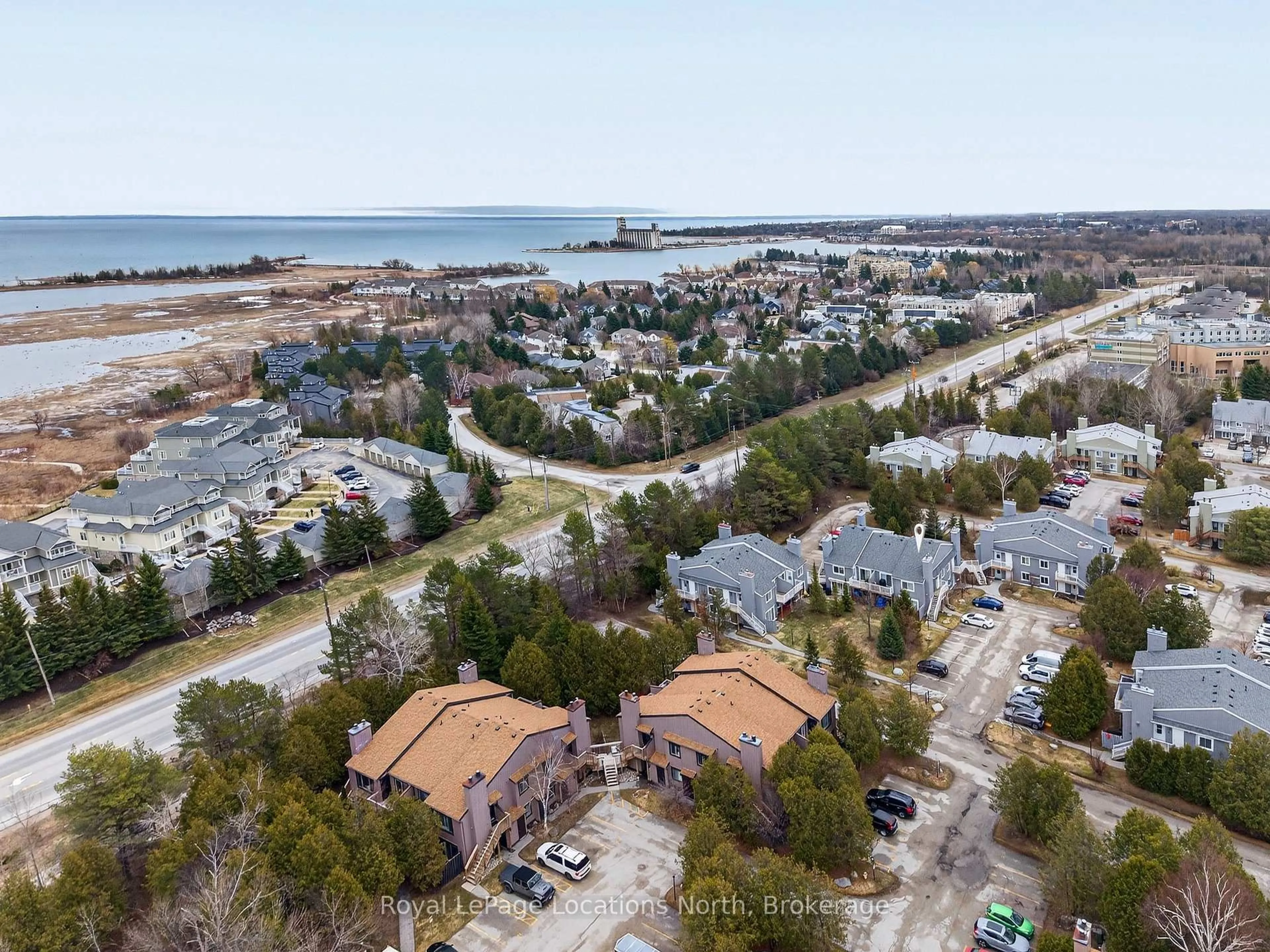 A pic from outside/outdoor area/front of a property/back of a property/a pic from drone, water/lake/river/ocean view for 23 Dawson Dr #91, Collingwood Ontario L9Y 5B4