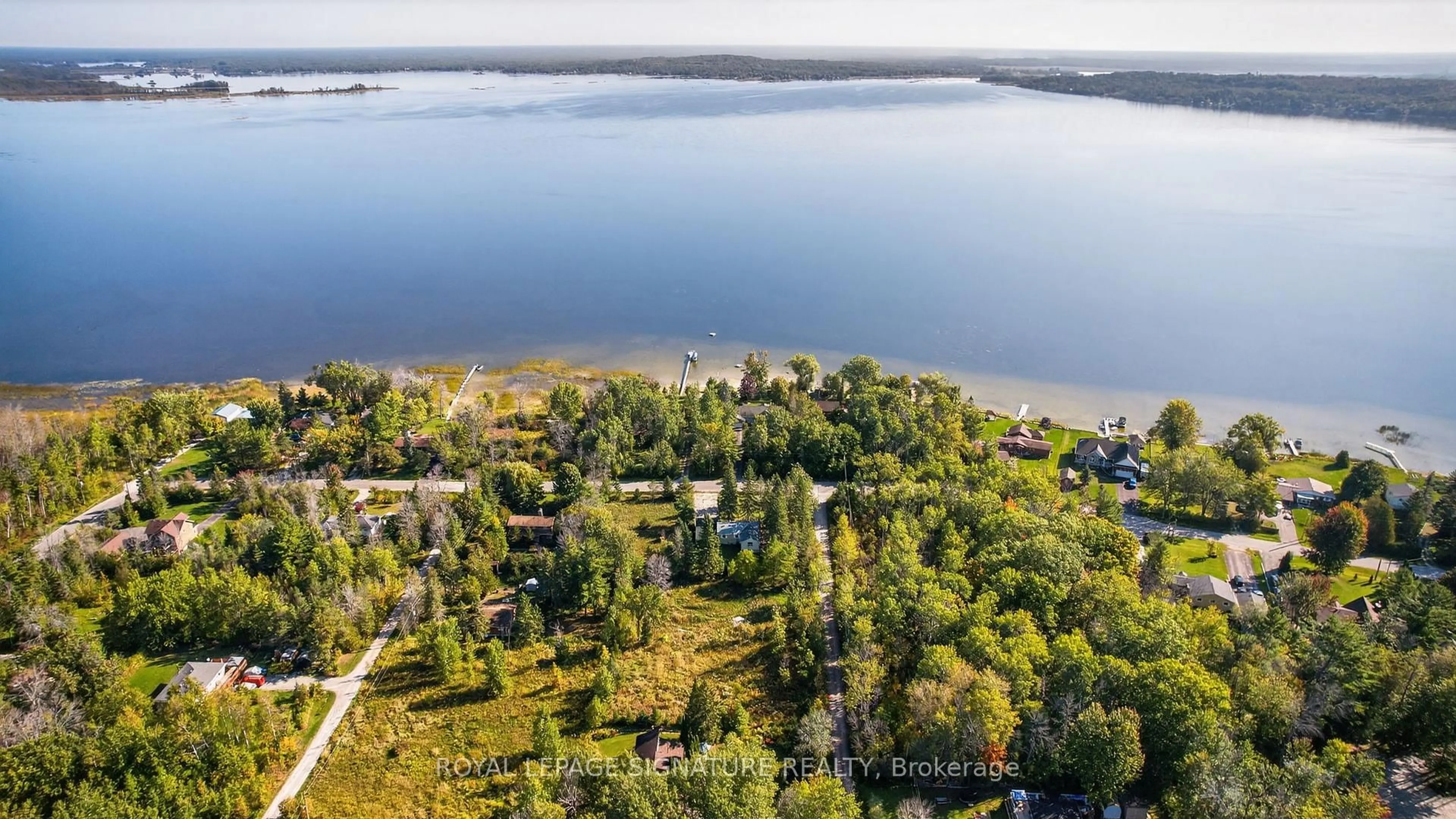 A pic from outside/outdoor area/front of a property/back of a property/a pic from drone, water/lake/river/ocean view for 81-77 Bass Bay Dr, Tay Ontario L0K 2A0