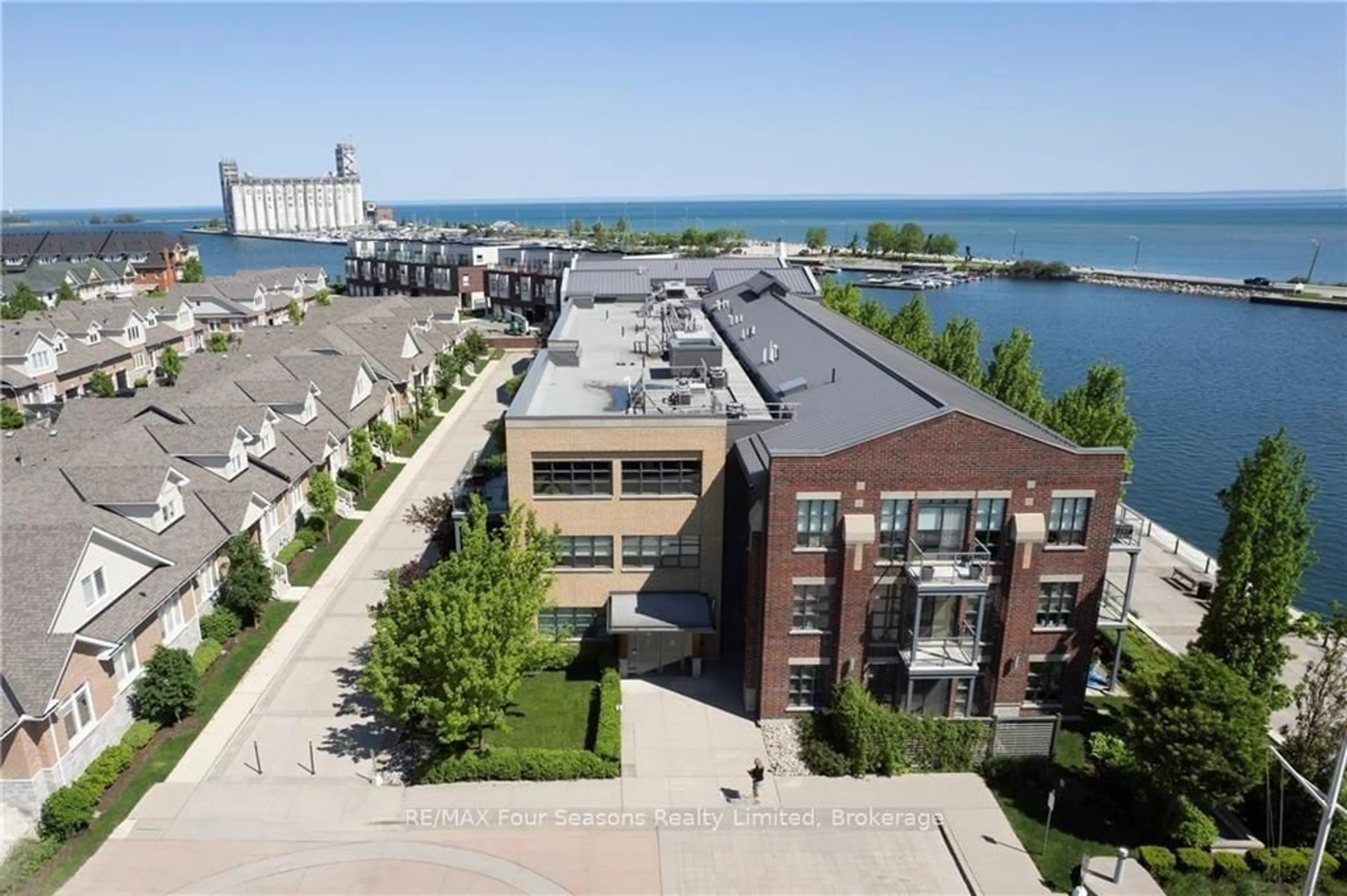 A pic from outside/outdoor area/front of a property/back of a property/a pic from drone, water/lake/river/ocean view for 1 Shipyard Lane #309, Collingwood Ontario L9Y 0W2