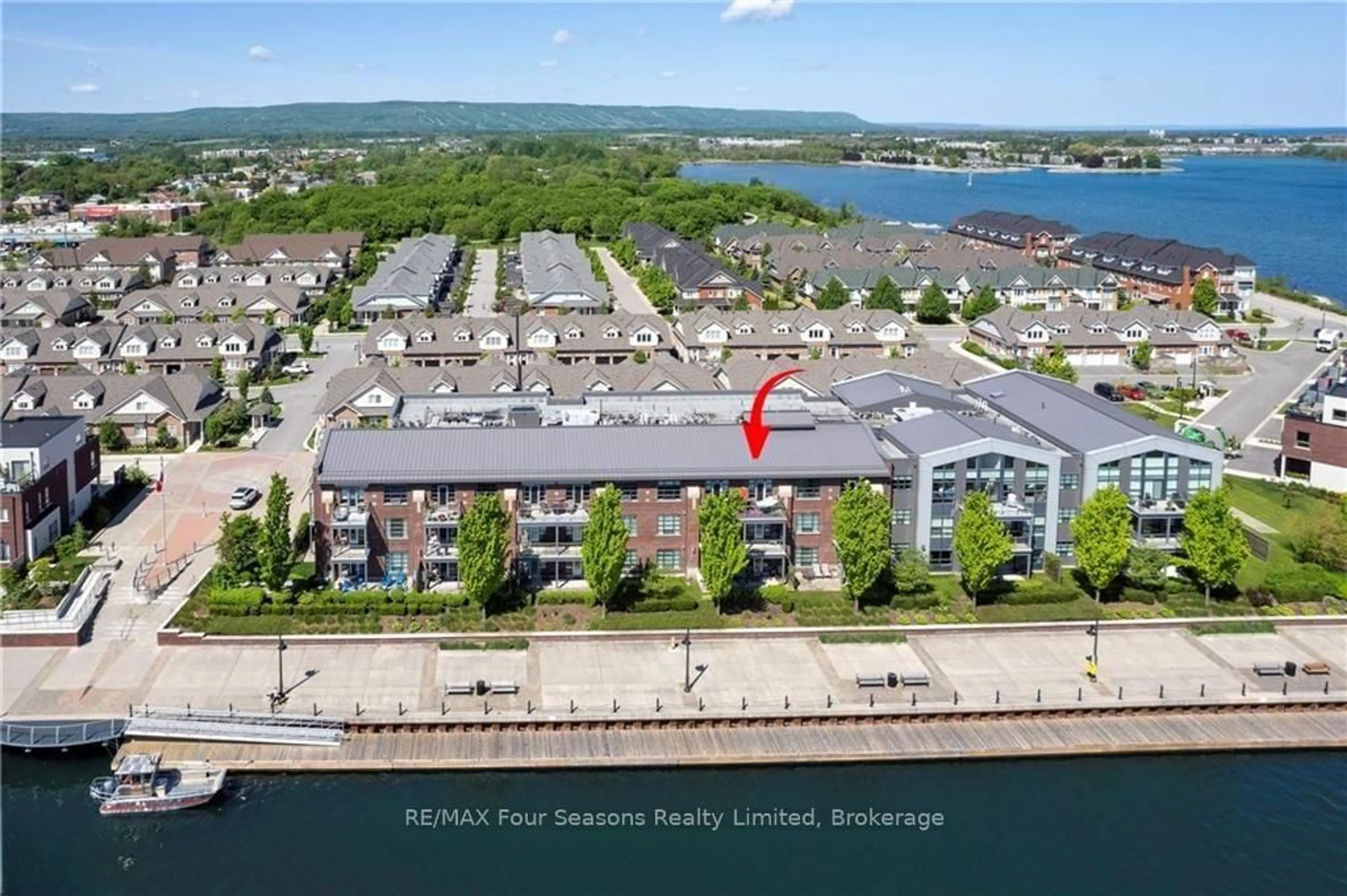 A pic from outside/outdoor area/front of a property/back of a property/a pic from drone, water/lake/river/ocean view for 1 Shipyard Lane #309, Collingwood Ontario L9Y 0W2