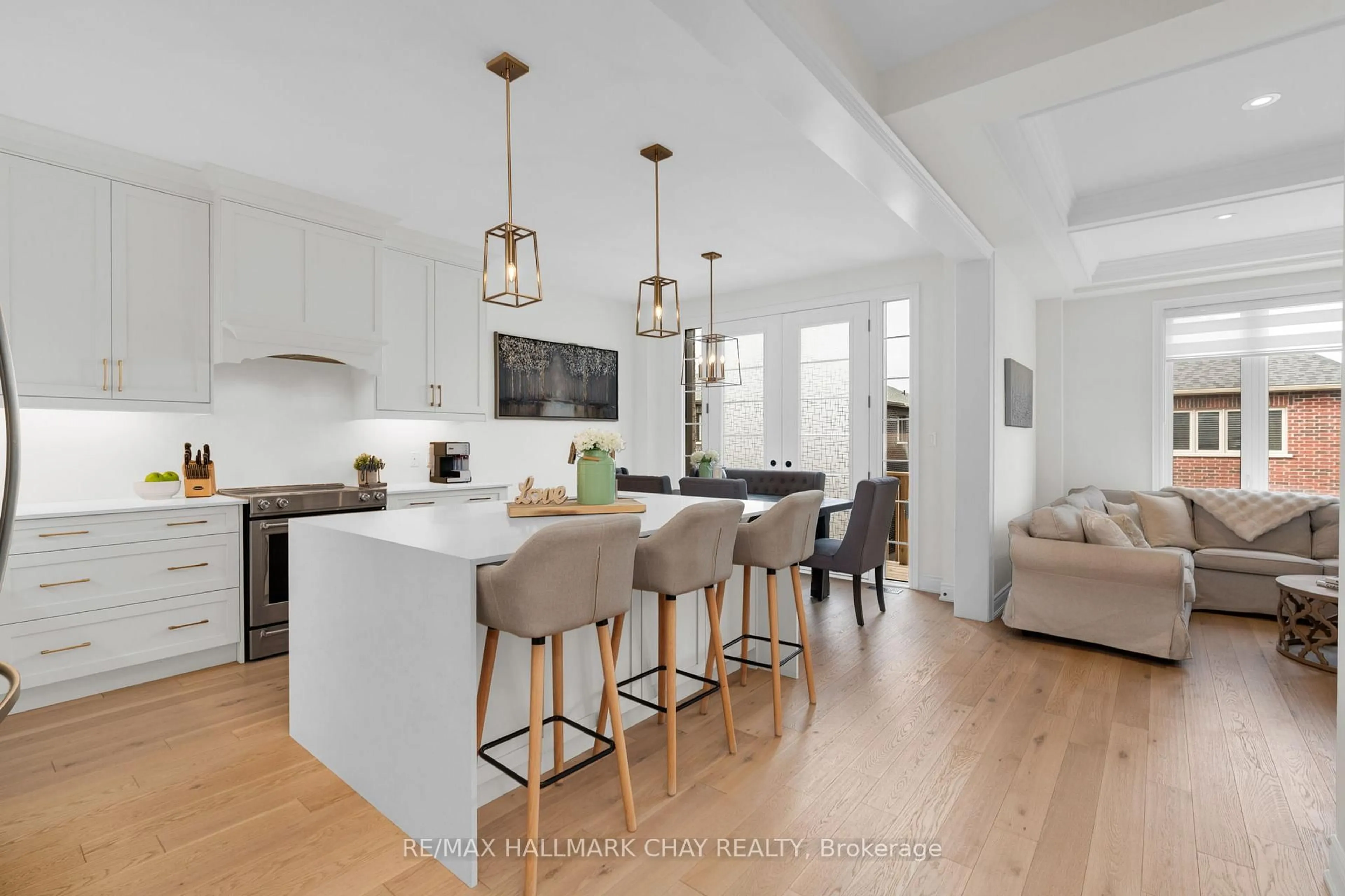 Open concept kitchen, wood/laminate floor for 4 Periwinkle Rd, Springwater Ontario L9X 2E2