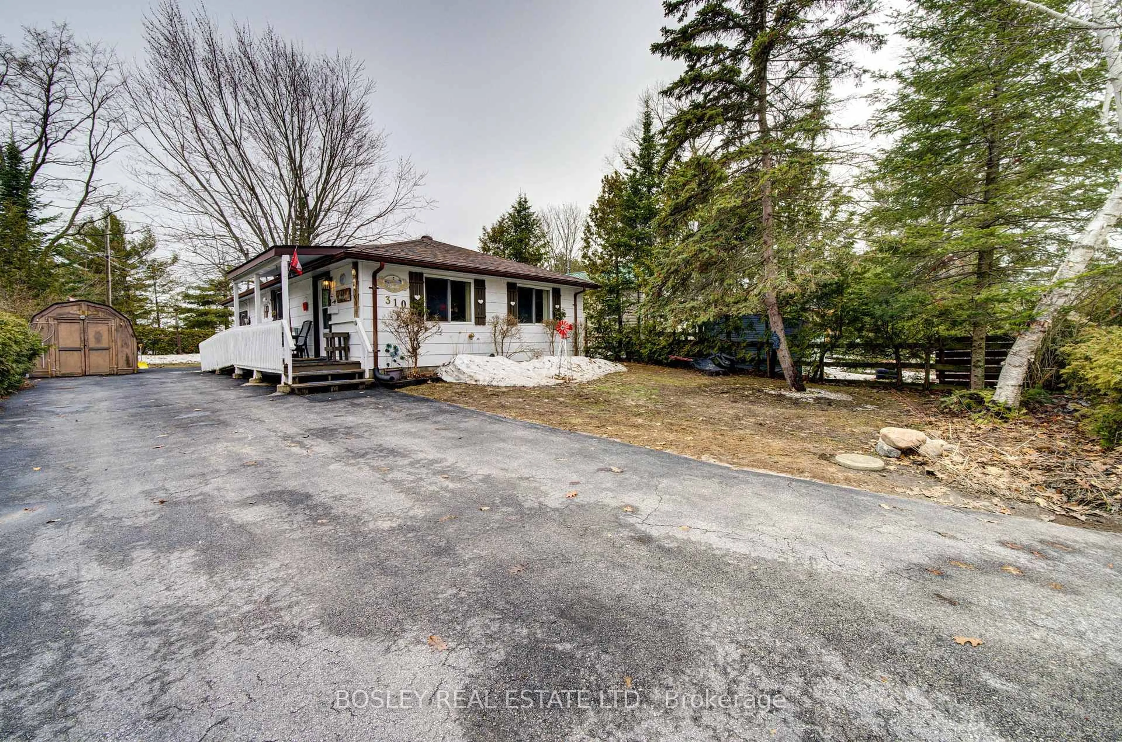 A pic from outside/outdoor area/front of a property/back of a property/a pic from drone, street for 310 Tiny Beaches Rd, Tiny Ontario L0L 2J0
