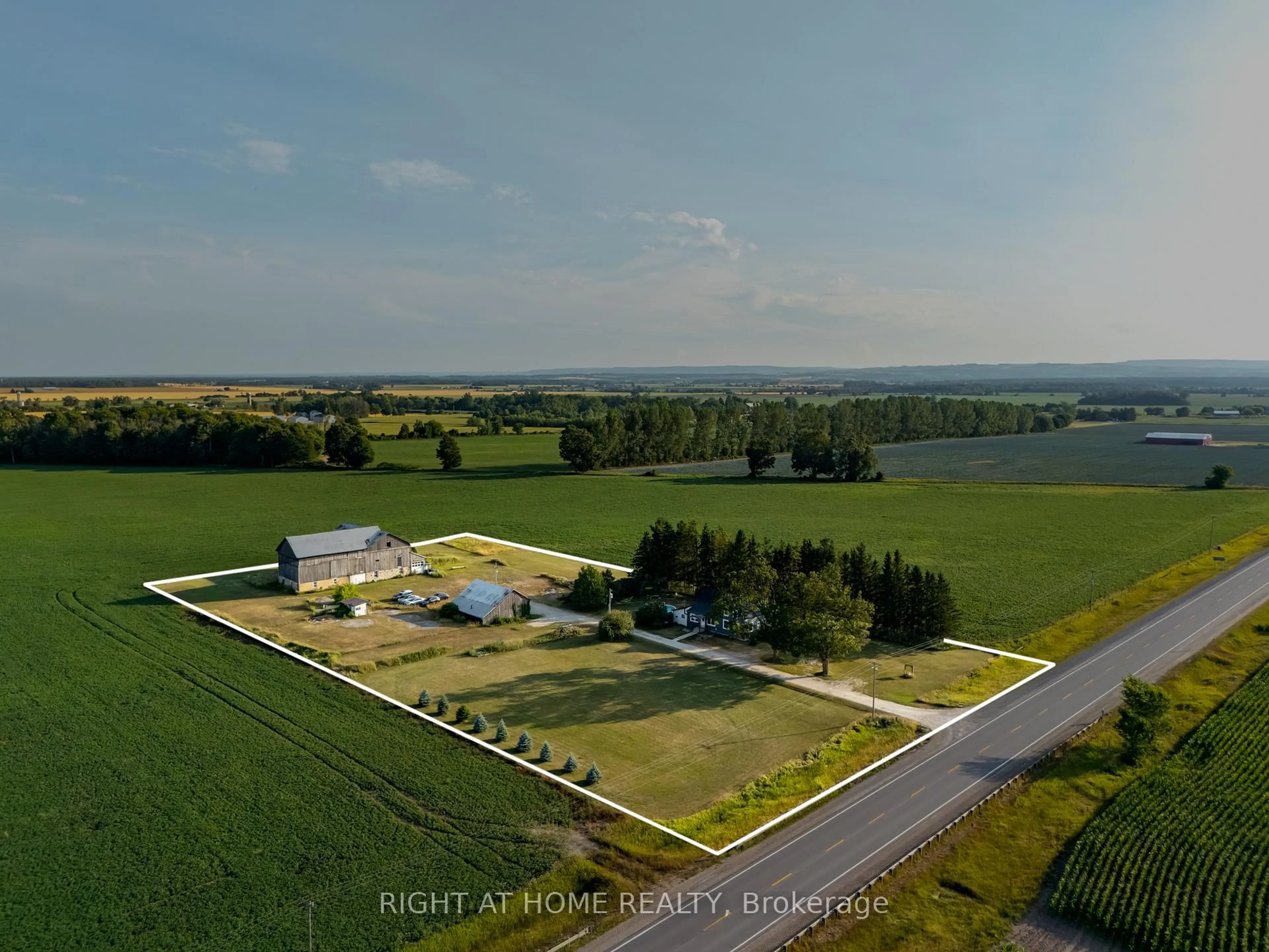 A pic from outside/outdoor area/front of a property/back of a property/a pic from drone, water/lake/river/ocean view for 5803 26 Highway, Clearview Ontario L0M 1S0