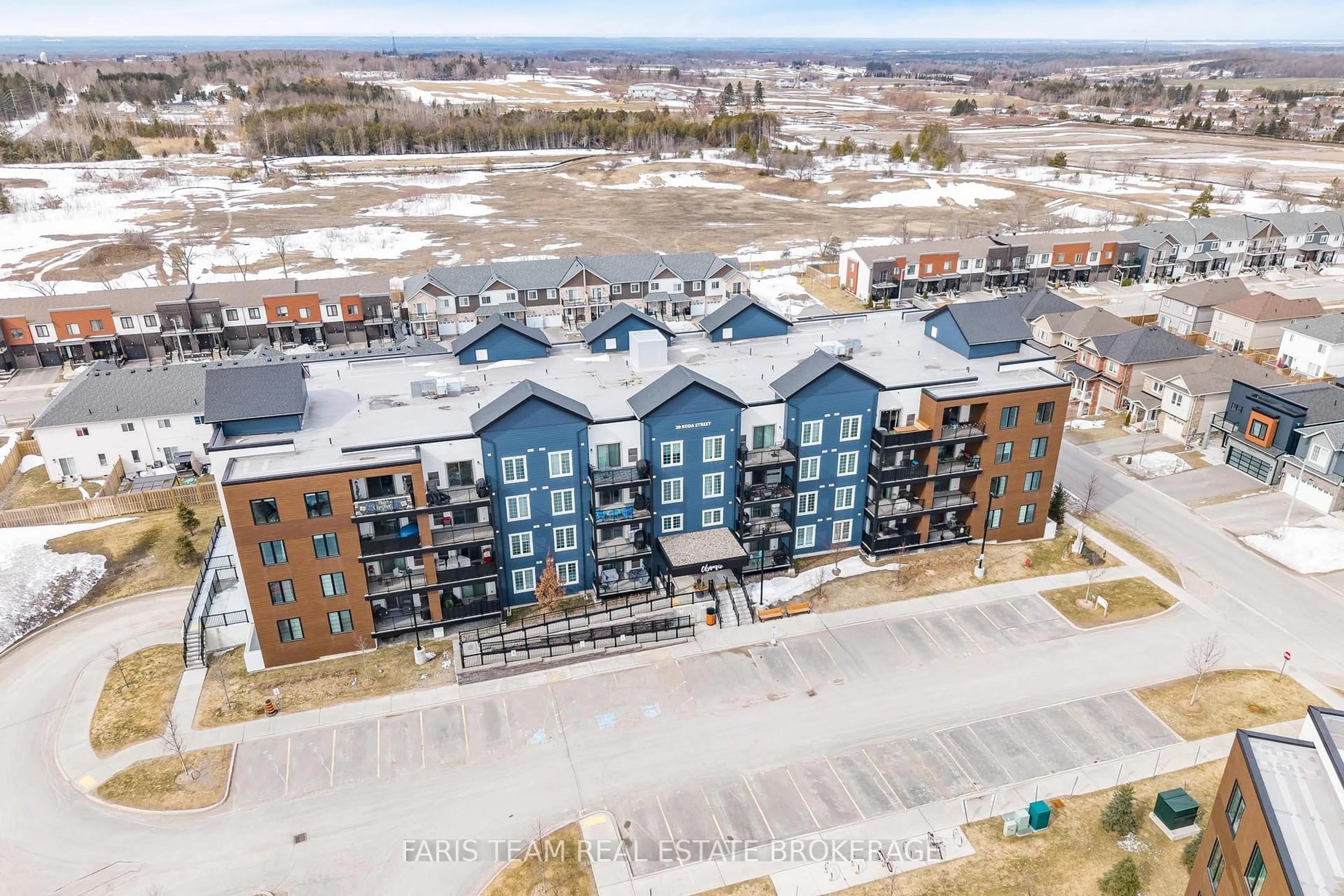 A pic from outside/outdoor area/front of a property/back of a property/a pic from drone, unknown for 20 Koda St #211, Barrie Ontario L9J 0J7